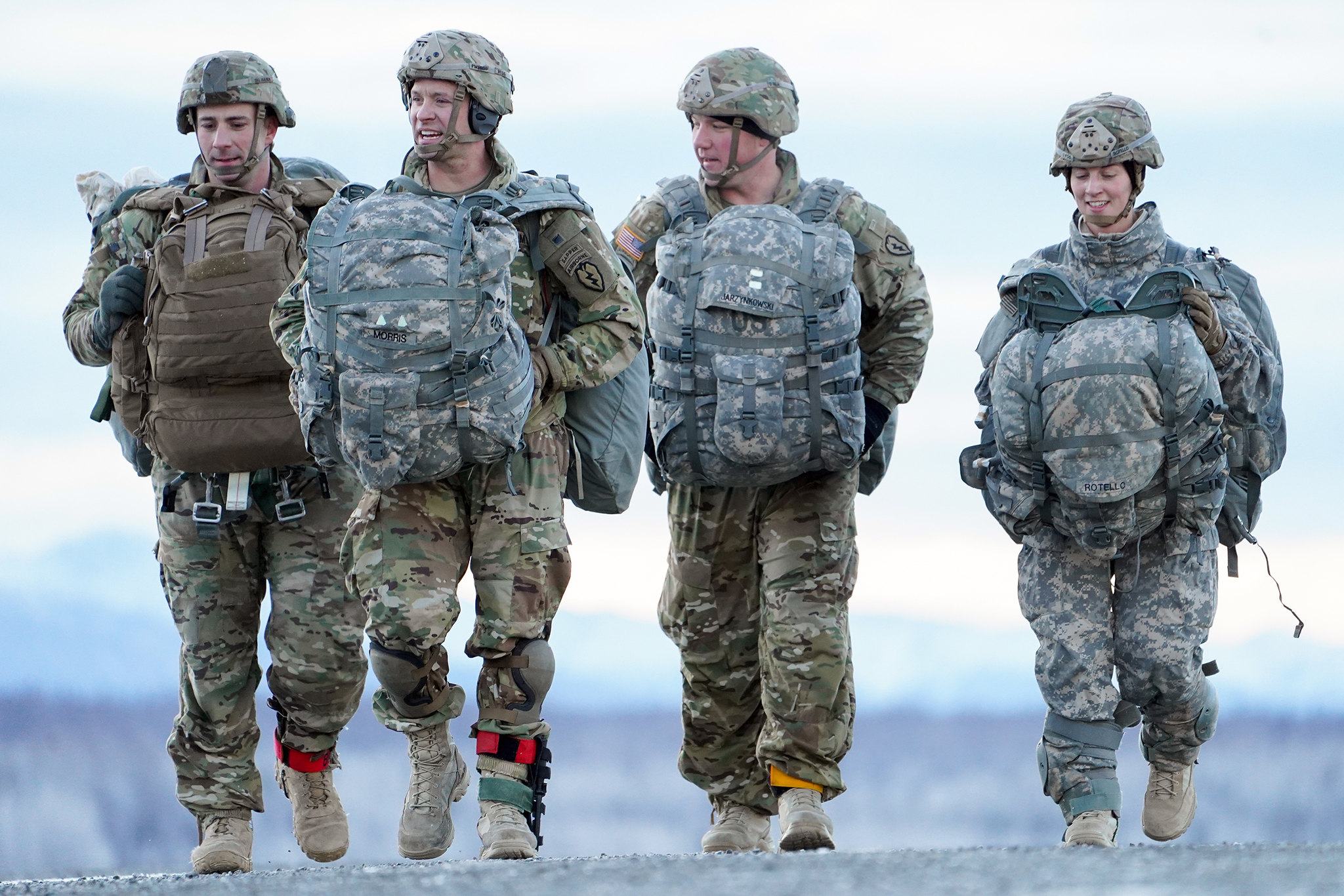 Soldiers make their way to a rally point after conducting a parachute jump on Malemute drop zone at Joint Base Elmendorf-Richardson, Alaska, Dec. 11, 2019. (Justin Connaher/Air Force)