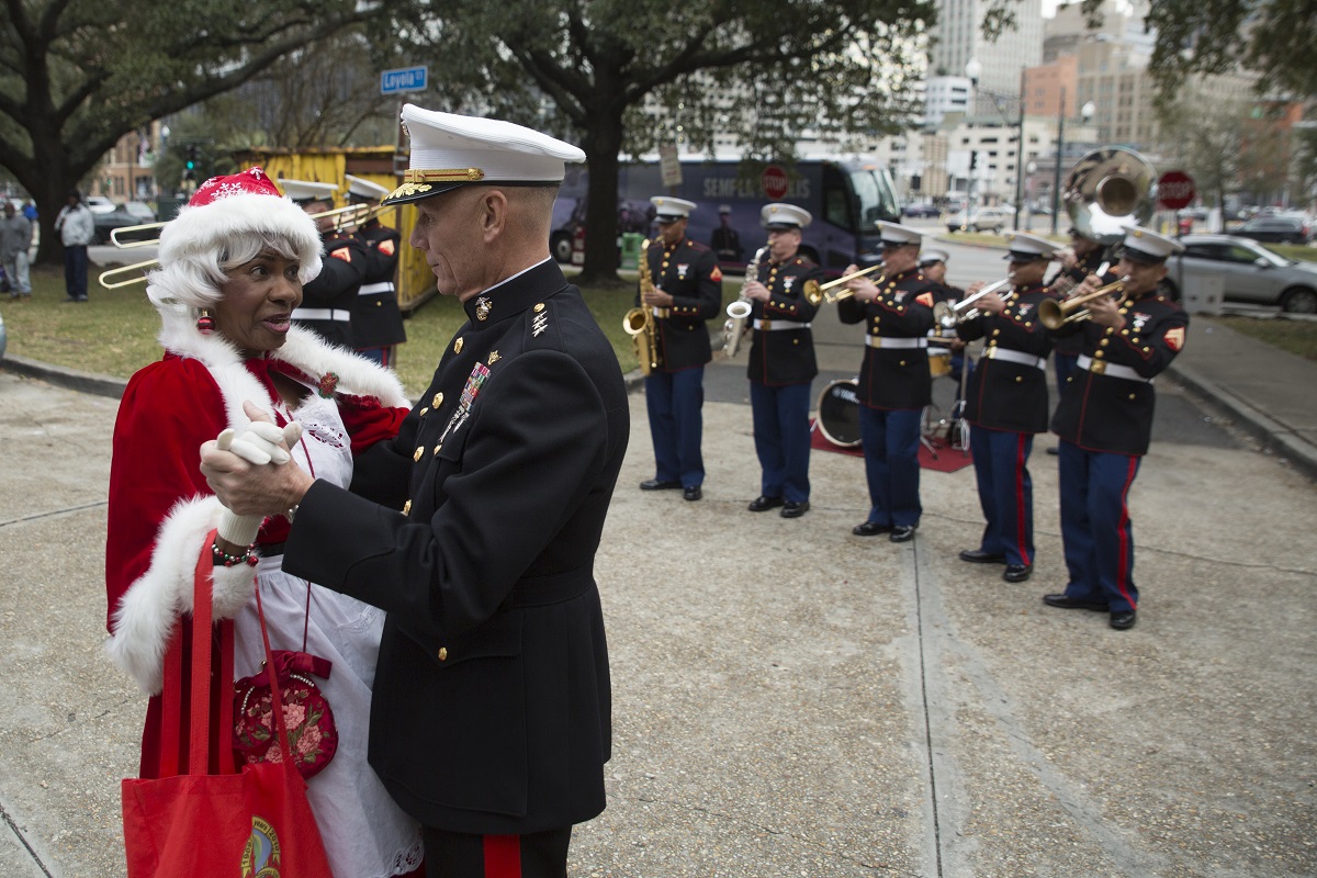 Lt. Gen. Rex C. McMillian, commander of Marine Forces Reserve and Marine Forces North, dances with Mrs. Claus during the Krewe of Zulu Toys for Tots toys distribution event at the New Orleans city hall, Dec. 16,2017. (Sgt. Ian Ferro/Marine Corps)