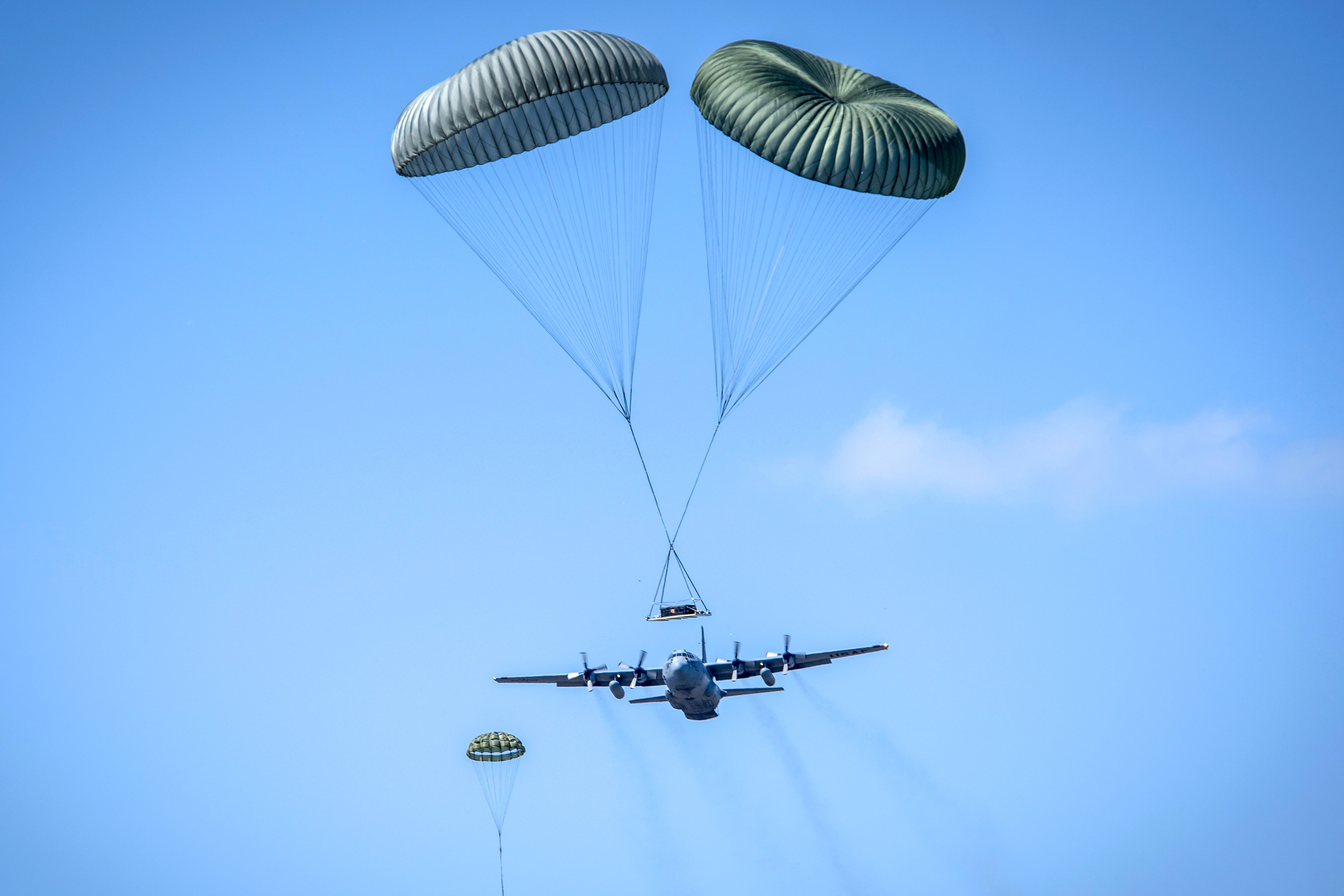 The 179th Airlift Wing conducts a five ship formation flight using five of their eight C-130H Hercules to conduct coordinated airdrops. (Tech. Sgt. Joe Harwood/Air Force)
