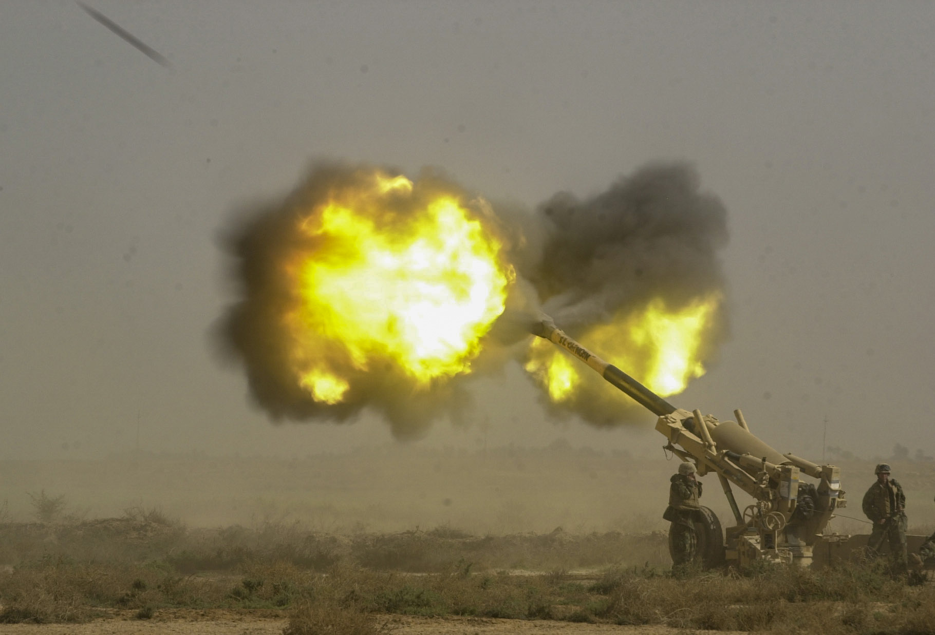 Marines from Battery M, 3rd Battalion, 11th Marine Regiment fire a 155mm Howitzer towards Iraqi military positions in Al Kut, Iraq . ( Jud McCrehin/Marine Corps Times)