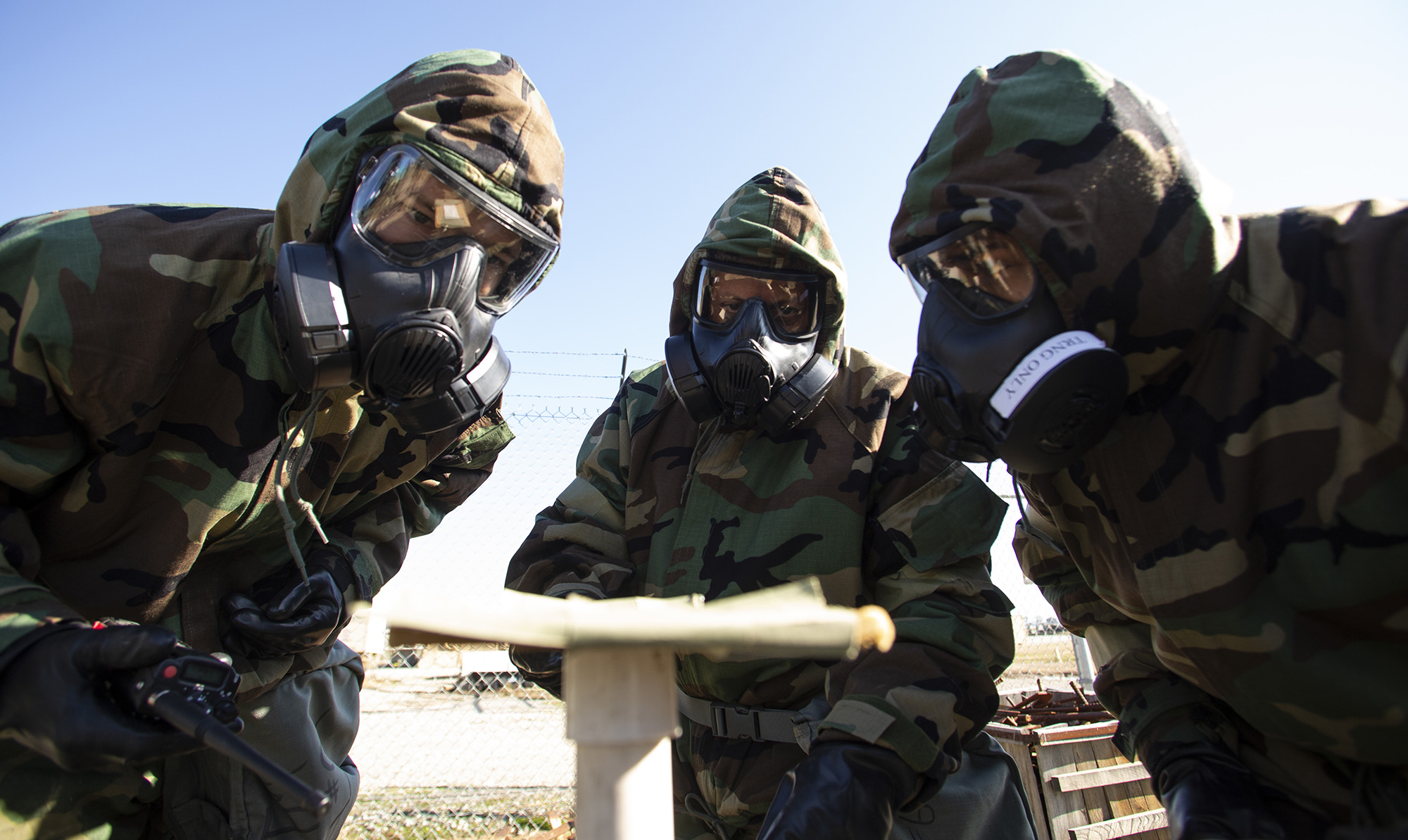 U.S. airmen with the 163d Attack Wing, California Air National Guard evaluate a reaction found on chemical detection paper during training on Jan. 11, 2020, at March Air Reserve Base, Calif. (Staff Sgt. Crystal Housman/Air National Guard)
