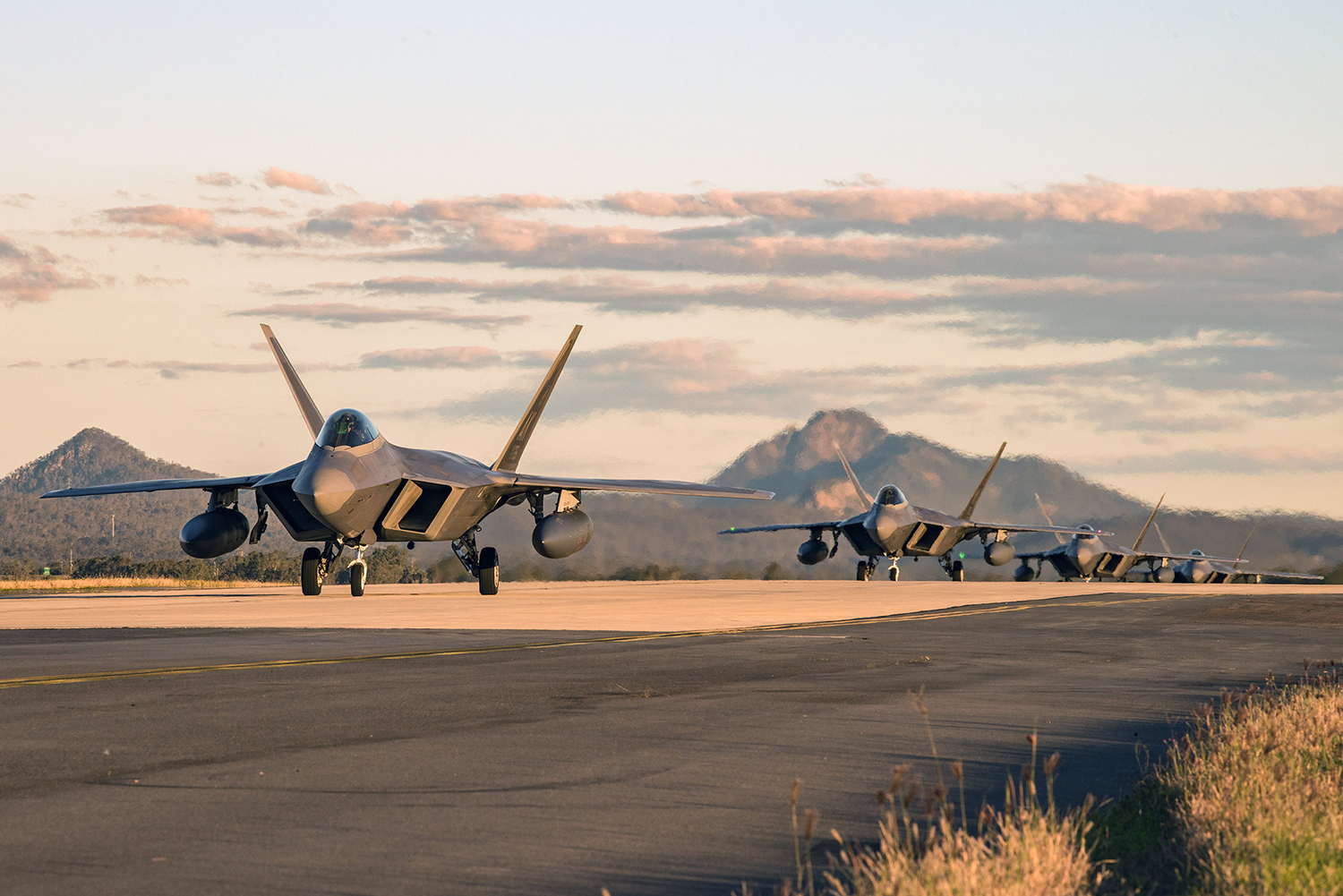 F-22 Raptors taxi to their parking location at the Royal Australian Air Force Base Amberley flightline for Talisman Sabre 19 on July 9. (Staff Sgt. Kyle Johnson/Air Force)