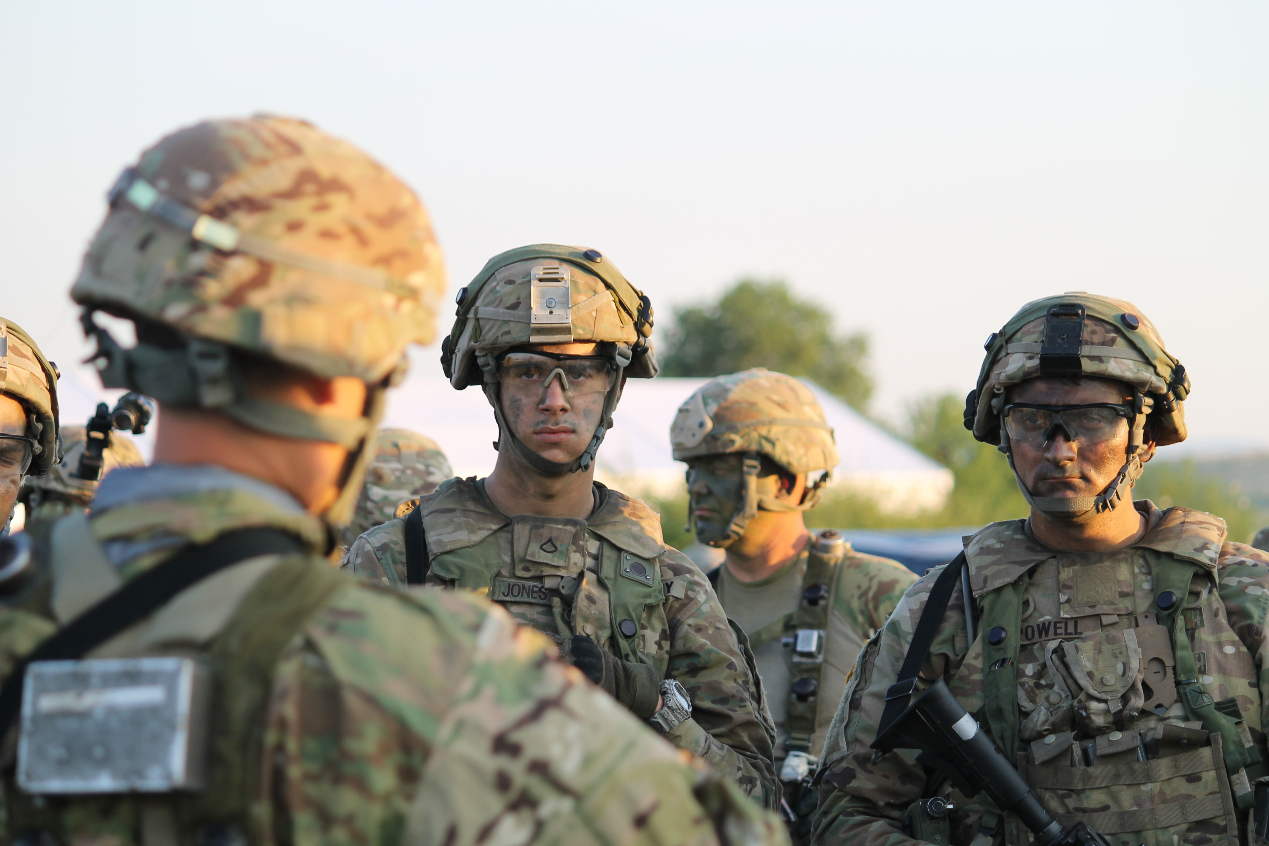 The U.S. Stryker unit listens to instructions before loading and heading over to the airfield. (Jen Judson/Staff)