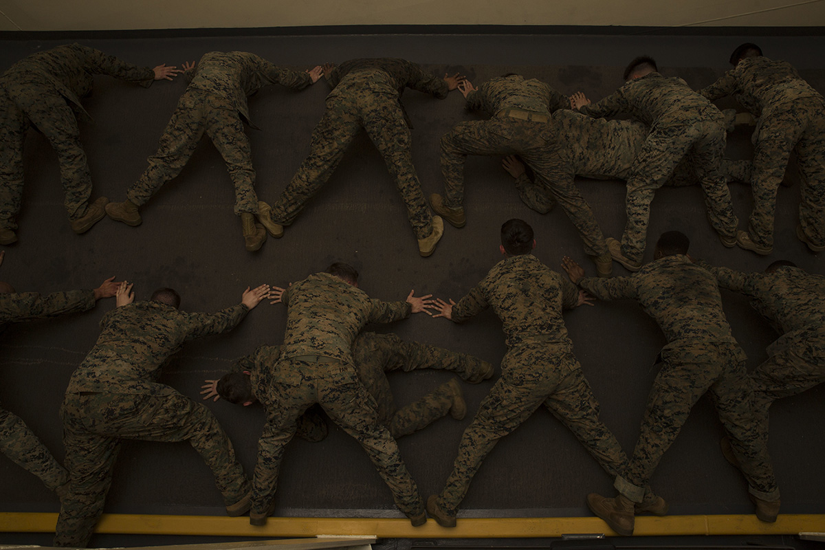 Marines exercise during a Marine Corps Martial Arts Program course aboard the San Antonio-class amphibious transport dock USS Anchorage (LPD 23), Dec. 10, 2018, in the U.S. 5th Fleet area of operations. (Sgt. Austin Mealy/Marine Corps)