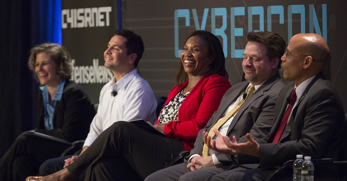 Jill Aitoro moderates a panel: Training on the Edge: with Joey Muniz, Technical Solutions Architect, Cisco, Deborah Pierre-Louis, Director of Policy, Liaison, and Training Office, Department of State, and Harry WIngo, Faculty member at College of Information and cyberspace, National Defense University at Cybercon 2017 at the Ritz-Carlton Hotel in Pentagon City on Nov. 28, 2017. ( Ben Murray/Staff)