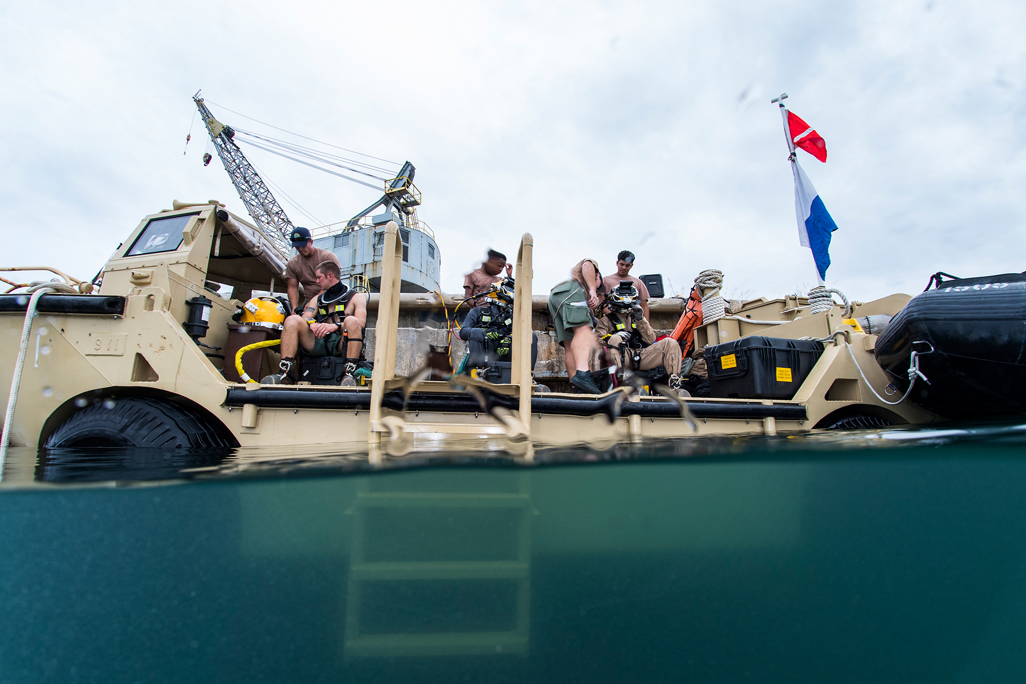 U.S. Navy Seabees, assigned to Underwater Construction Team (UCT) 2, prepare for underwater welding operations at Naval Base Guam, Oct. 19, 2017. UCT-2 provides responsive inshore and underwater construction capabilities under the guidance of Commander, Task Force 75. (Specialist 1st Class Arthurgwain L. Marquez/Navy)