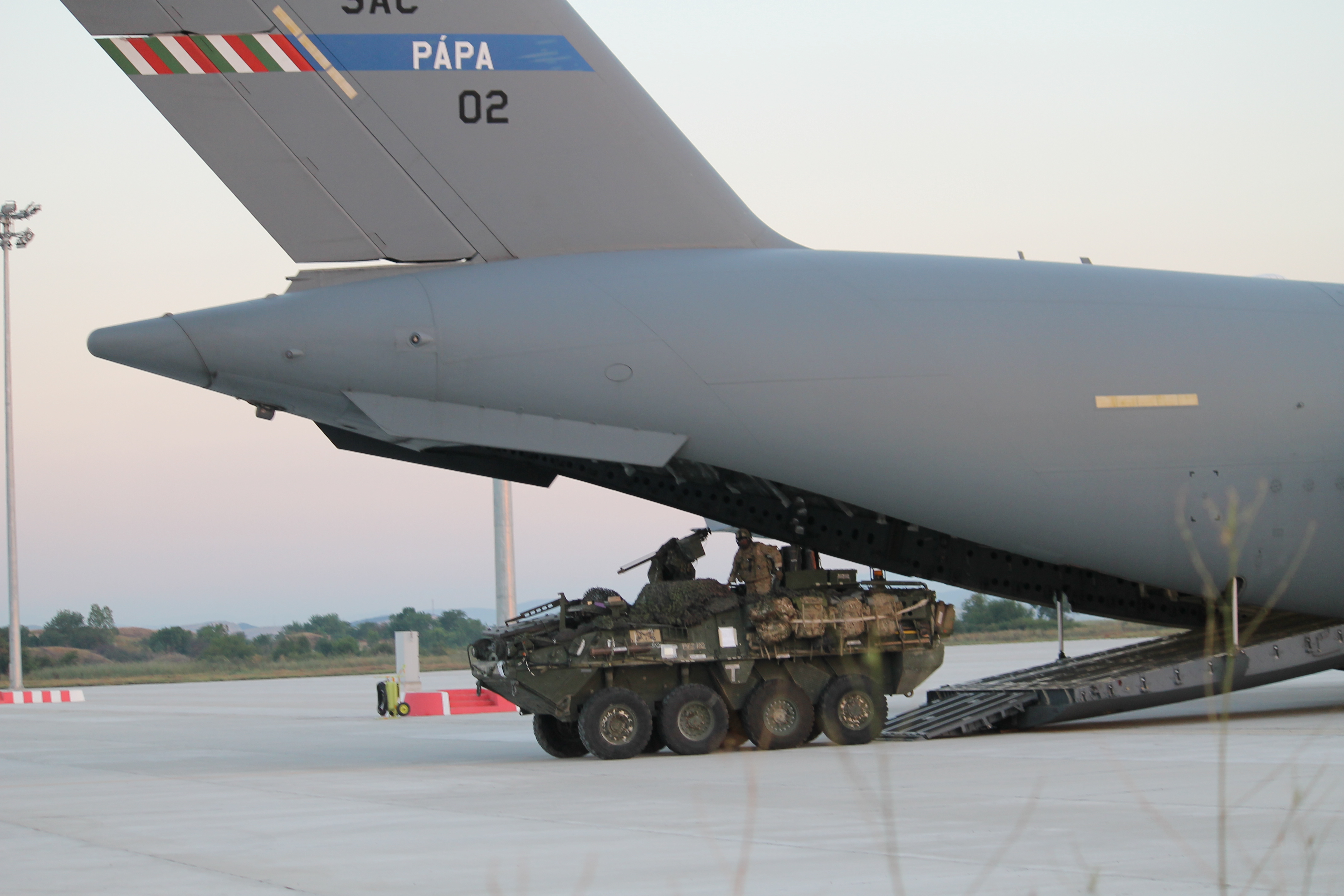 A U.S. Stryker drives out of the C-17. The aircraft was holding two vehicles. Another C-17 was not far behind, delivering another two Strykers for the operation. (Jen Judson/Staff)