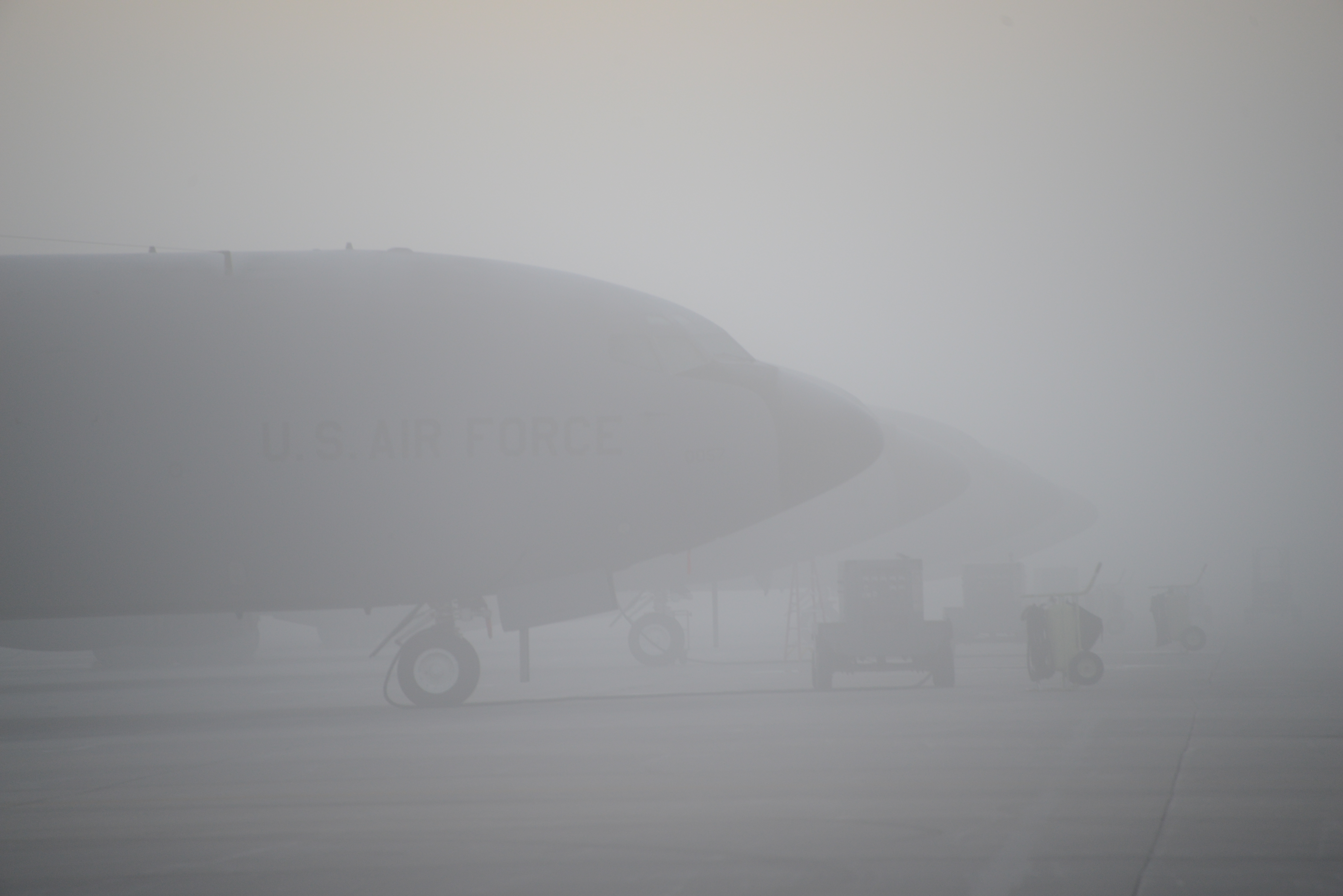 Thick fog envelops several Air Force KC-135 mid-air refueling aircraft on the flight line at the Iowa Air National Guard’s 185th Air Refueling Wing in Sioux City, Iowa in the early morning hours of Oct. 10, 2017. (Master Sgt. Vincent De Groot/U.S. Air National Guard)