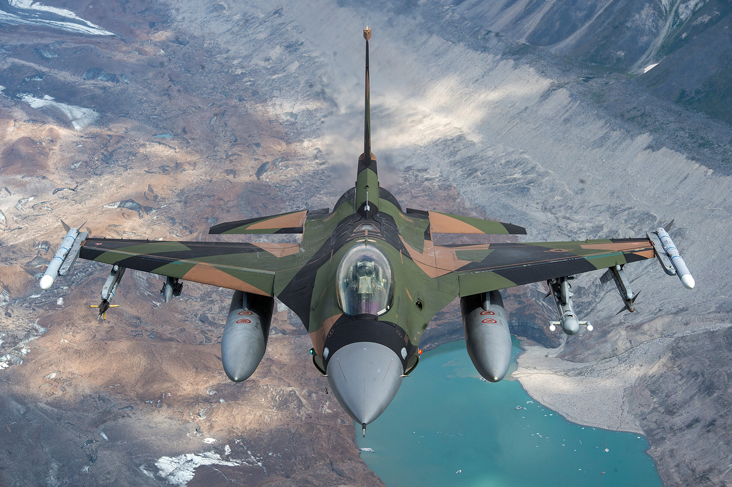 An Air Force F-16 Fighting Falcon from Eielson Air Force Base flies in formation over the Joint Pacific Alaska Range Complex, July 18, 2019. (Staff Sgt. James Richardson/Air Force)