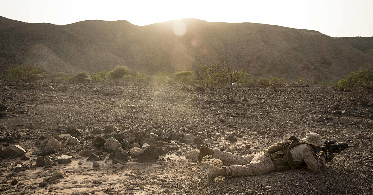 Lance Cpl. Riley Crider, a machine gunner assigned to Kilo Company, Battalion Landing Team 3/1, 13th Marine Expeditionary Unit, waits for orders during a fire team maneuver drill while participating in Theater Amphibious Combat Rehearsal (TACR) 18 in Djibuouti. (Cpl. Danny Gonzalez/Marine Corps)