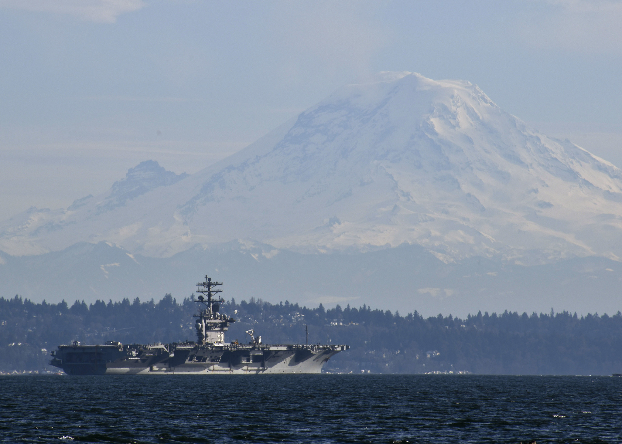 The aircraft carrier Nimitz (CVN 68) passes Mount Rainier while transiting Puget Sound on Feb. 21, 2020. (Mass Communication Specialist Seaman Olivia Banmally Nichols/Navy)