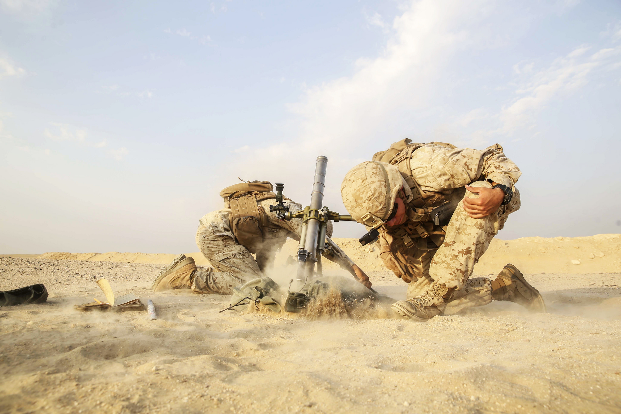Marines with Battalion Landing Team, 1st Battalion, 5th Marine Regiment, 15th Marine Expeditionary Unit fire a M224 60 mm mortar system. (Cpl. Timothy Valero/Marine Corps)