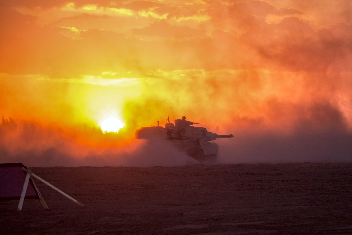 A Marines M1A1 Abrams tank is shrouded in sand during a low-light live-fire exercise as part of Exercise Arrow 18 in Pohjankangas Training Area near Kankaanpaa, Finland, May 16, 2018. Marines with Bravo Company, 4th Tanks Battalion, participated in this live-fire exercise with the Finnish Leopard tanks. Exercise Arrow is an annual Finnish multi-national exercise with the purpose of training with mechanized infantry, artillery, and mortar field training skills in a live-fire exercise. This is the first year the Marine Corps is participating in this exercise and the first time the M1A1 Abrams tanks have been in Finland. (Sgt. Averi Coppa/Marines)