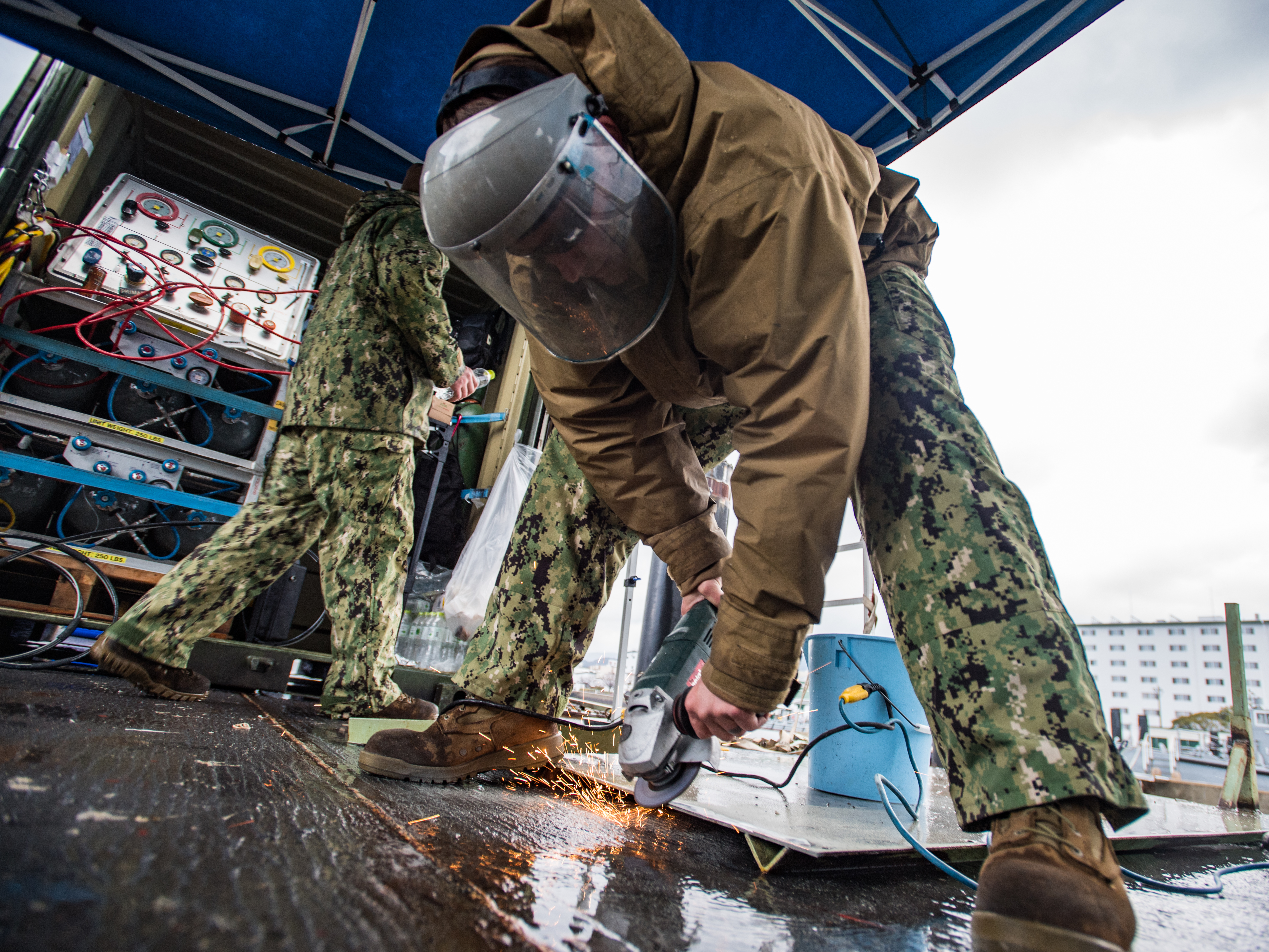 U.S. Navy Builder 2nd Class Sean McHugh, assigned to Underwater Construction Team (UCT) 2, repairs a ladder prior to an underwater pile removal operation at Commander, Fleet Activities Sasebo (CFAS), Jan. 10, 2018. (U.S. Navy Combat Camera photo by Arthurgwain L. Marquez)