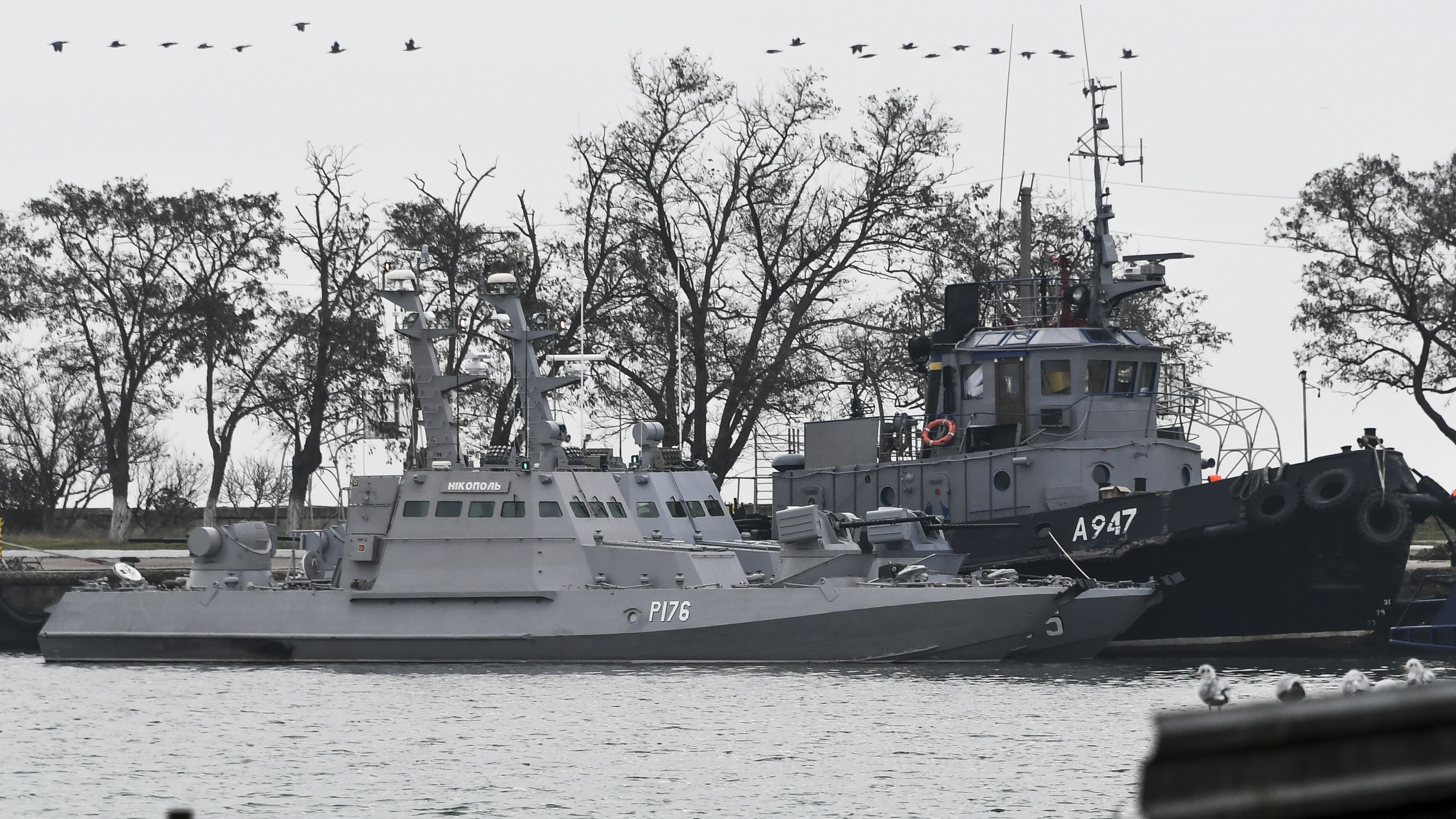 Three Ukrainian naval ships are seen at dock the day after being seized by Russian forces on Sunday, Nov. 25, 2018, in Kerch, Crimea, The Ukrainian parliament is set to consider a presidential request for the introduction of martial law in Ukraine following an incident in which Russian coast guard ships fired on the two Ukrainian navy gunboats and tugboat. (AP Photo)