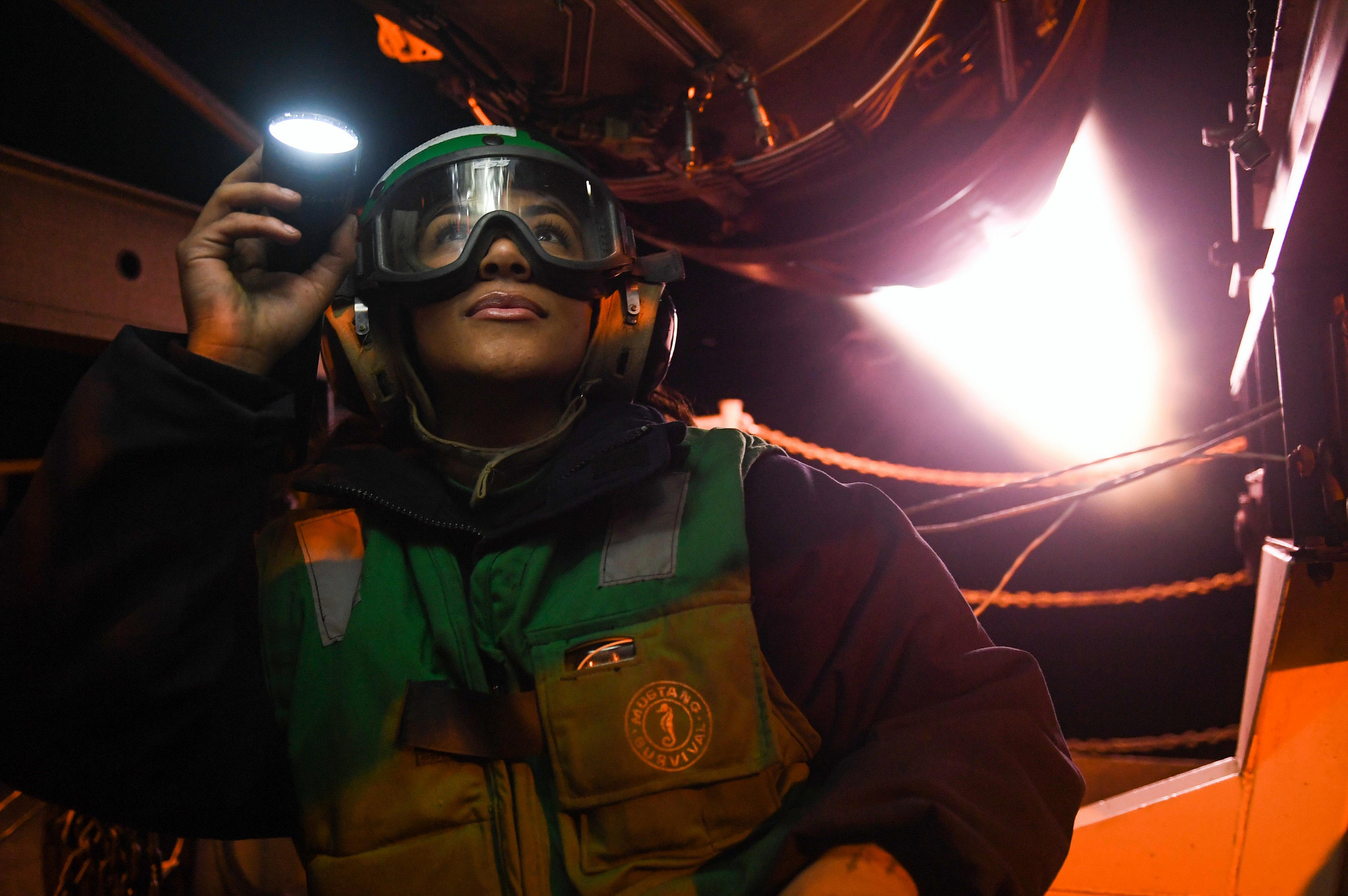 Aviation Machinist's Mate Airman Jadah Martinez inspects an after burner for fuel leaks Oct. 26, 2018, during an active test on the fantail aboard the Nimitz-class aircraft carrier USS Harry S. Truman (CVN 75) in the Norwegian Sea. (MC3 Victoria Granado/Navy)