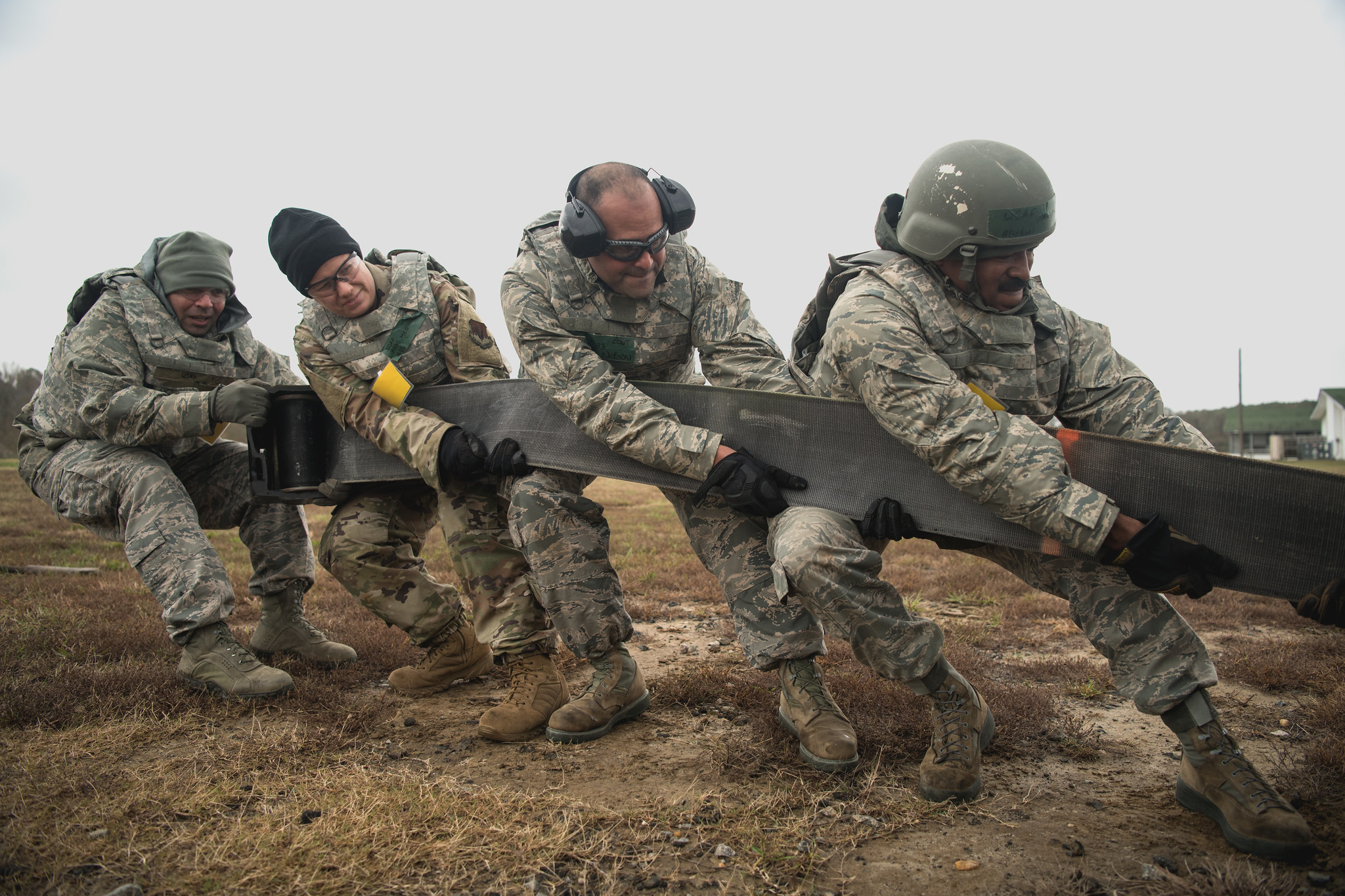 Airmen assigned to the 203rd RED HORSE Squadron, Virginia Air National Guard set up a mobile aircraft arresting cable during a four-day field training exercise on Nov. 16, 2019. (Senior Airman Bryan Myhr/Air National Guard)