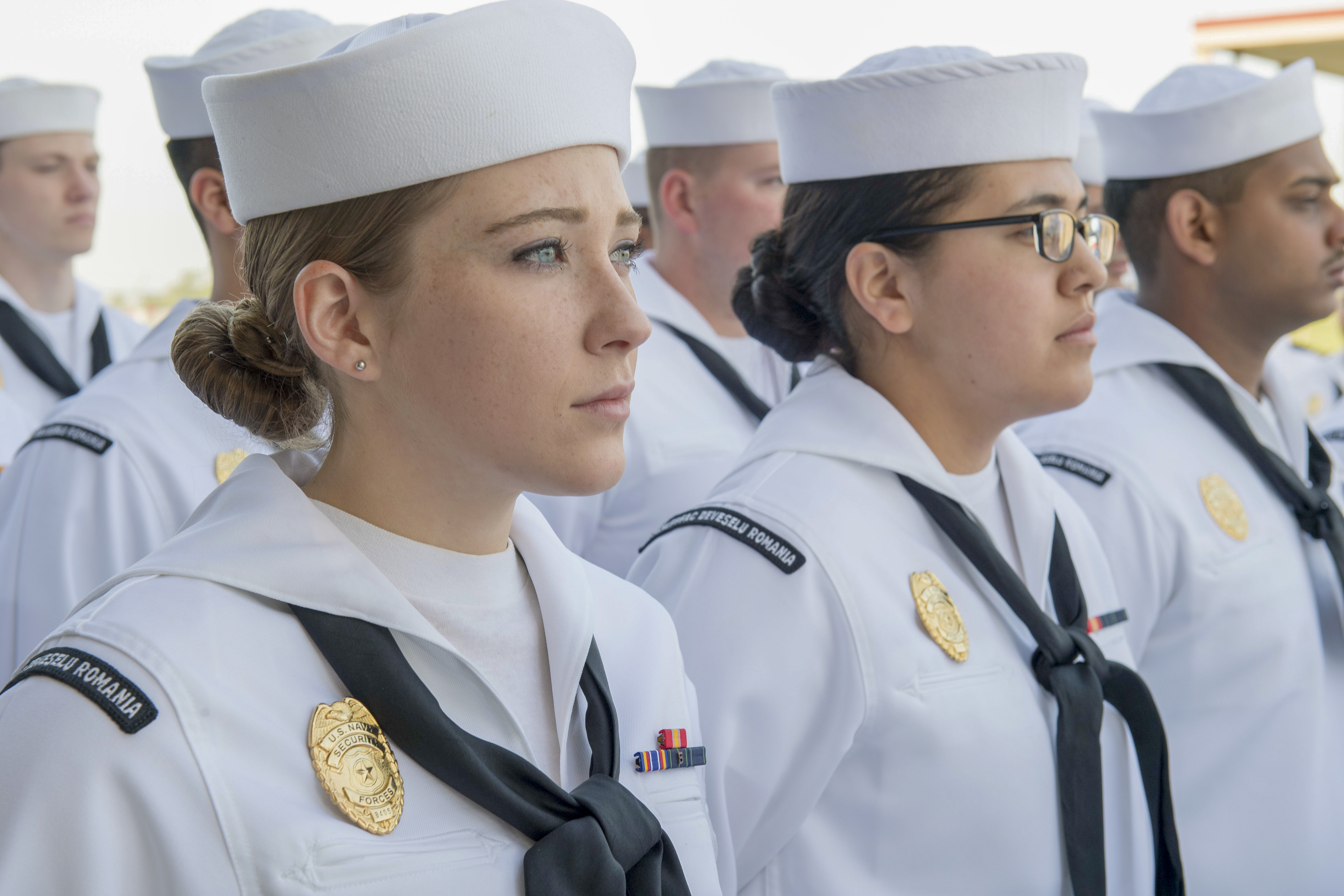Sailors at Naval Support Facility (NSF) Deveselu, Romania, stand in formation for a dress white uniform inspection May 1, 2018. NSF Deveselu and AAMDS Romania are co-located with the Romanian 99th Military Base and play a key role in ballistic missile defense in Eastern Europe. (U.S. MC1 Jeremy Starr/Navy)