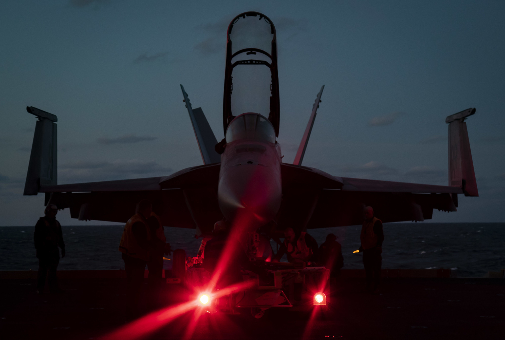 Sailors assigned to the aircraft carrier USS Gerald R. Ford (CVN 78) prepare to move an F/A-18F Super Hornet from an aircraft elevator to the hangar bay on Jan. 23, 2020, in the Atlantic Ocean. (Mass Communication Specialist 3rd Class Connor Loessin/Navy)
