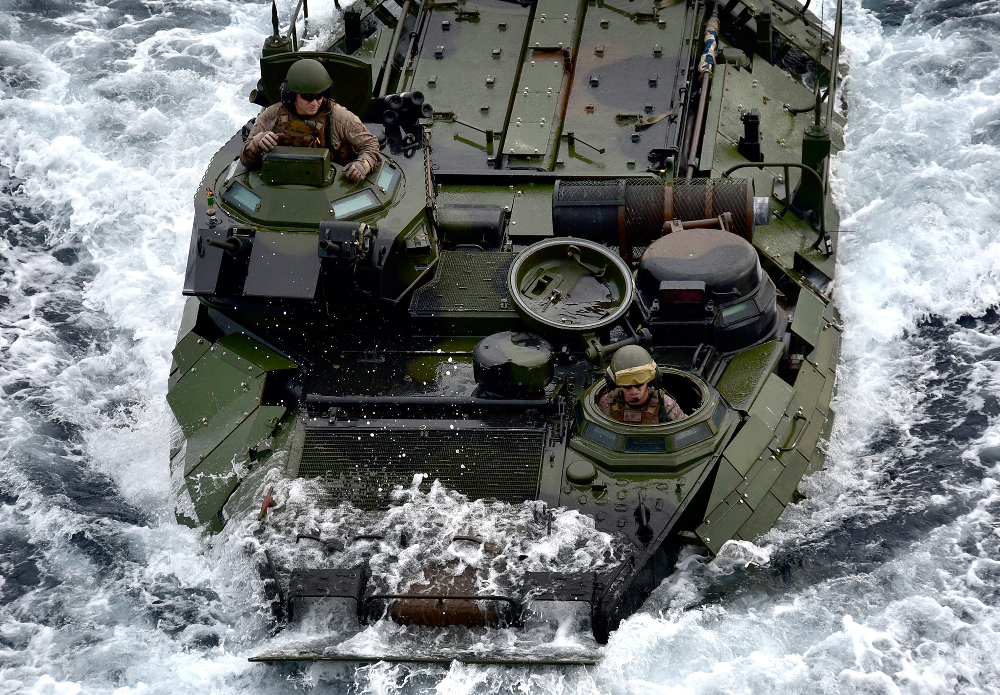 A Marine Corps assault amphibious vehicle enters the well deck of the amphibious assault ship USS Wasp (LHD 1) on March 25, 2019, in the Philippine Sea. (Mass Communication Specialist 1st Class Daniel Barker/Navy)