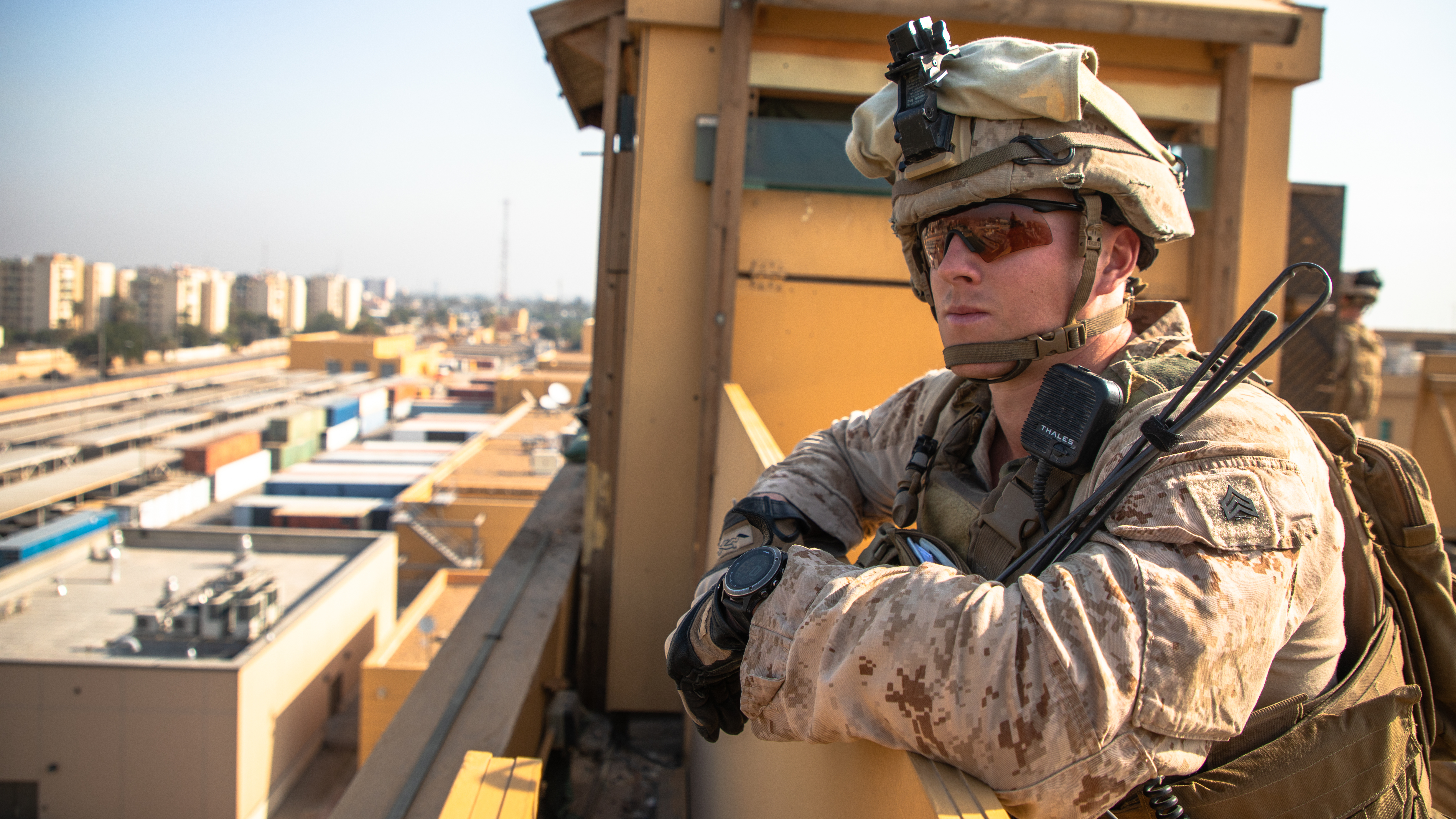 A U.S. Marine with 2nd Battalion, 7th Marines, assigned to the Special Purpose Marine Air-Ground Task Force-Crisis Response-Central Command (SPMAGTF-CR-CC) 19.2, supervises his squad as they provide over watch security at the Baghdad Embassy Compound in Iraq, Jan. 3, 2019. (Sgt. Kyle C. Talbot/Marine Corps)