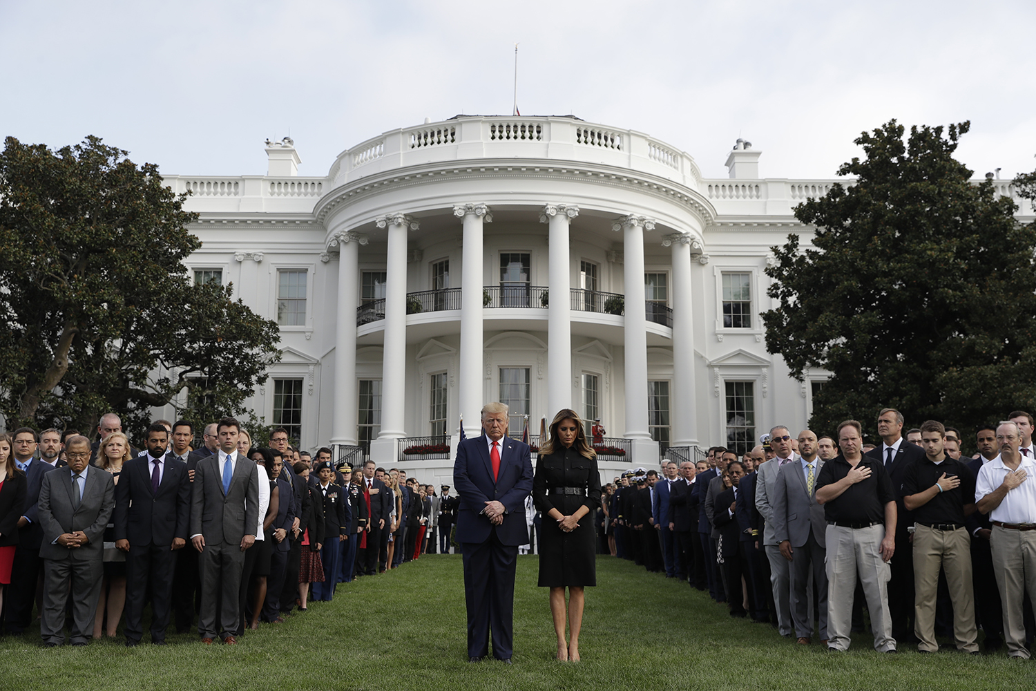 President Donald Trump and first lady Melania Trump participate in a moment of silence honoring the victims of the Sept. 11 terrorist attacks, on the South Lawn of the White House, Wednesday, Sept. 11, 2019, in Washington. (Evan Vucci/AP)