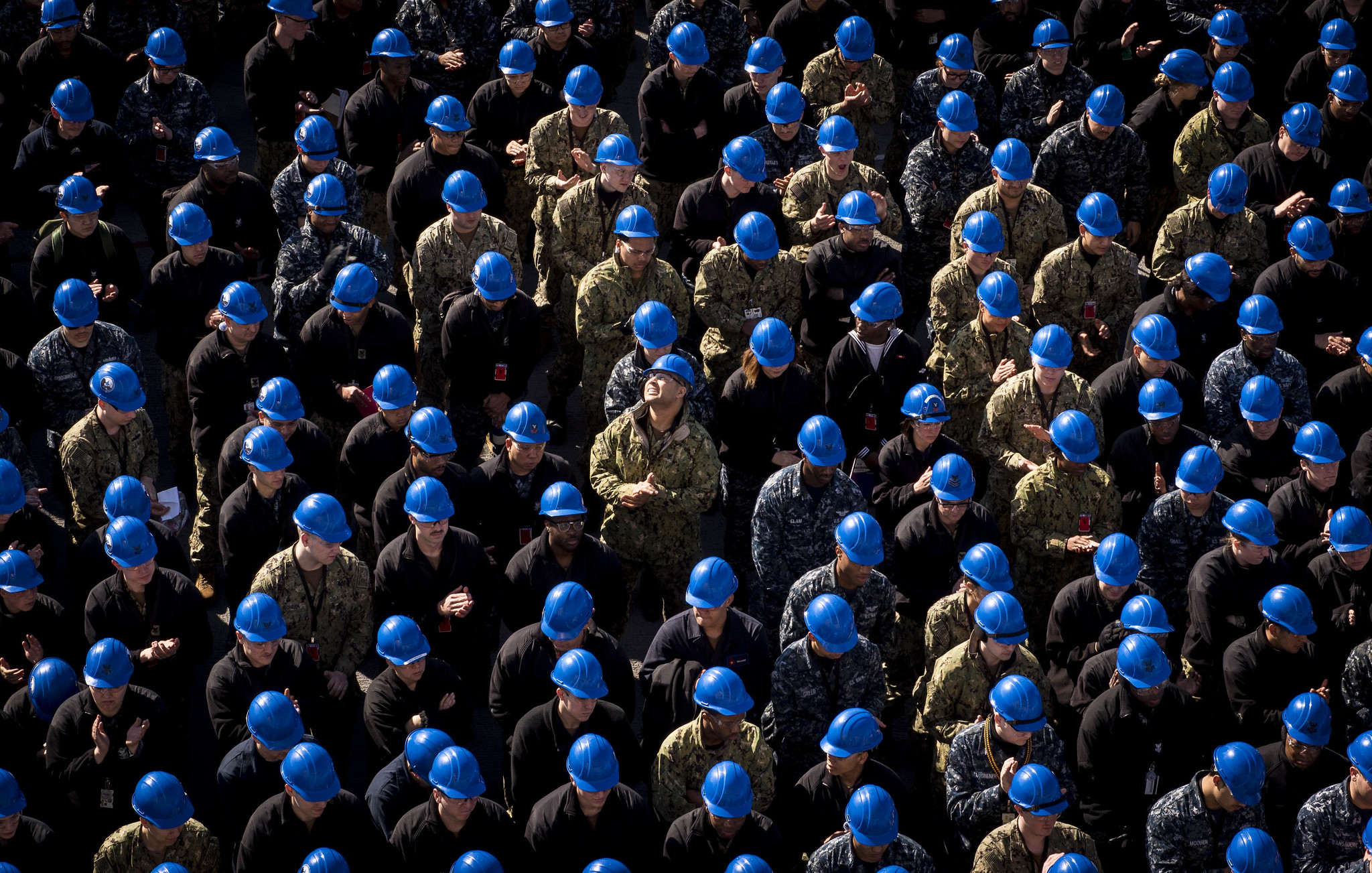 Sailors applaud after an award was announced March 22, 2019, at an all hands call on the flight deck aboard the aircraft carrier USS George H.W. Bush (CVN 77) in Portsmouth, Va. (Mass Communication Specialist Seaman Steven Edgar/Navy)