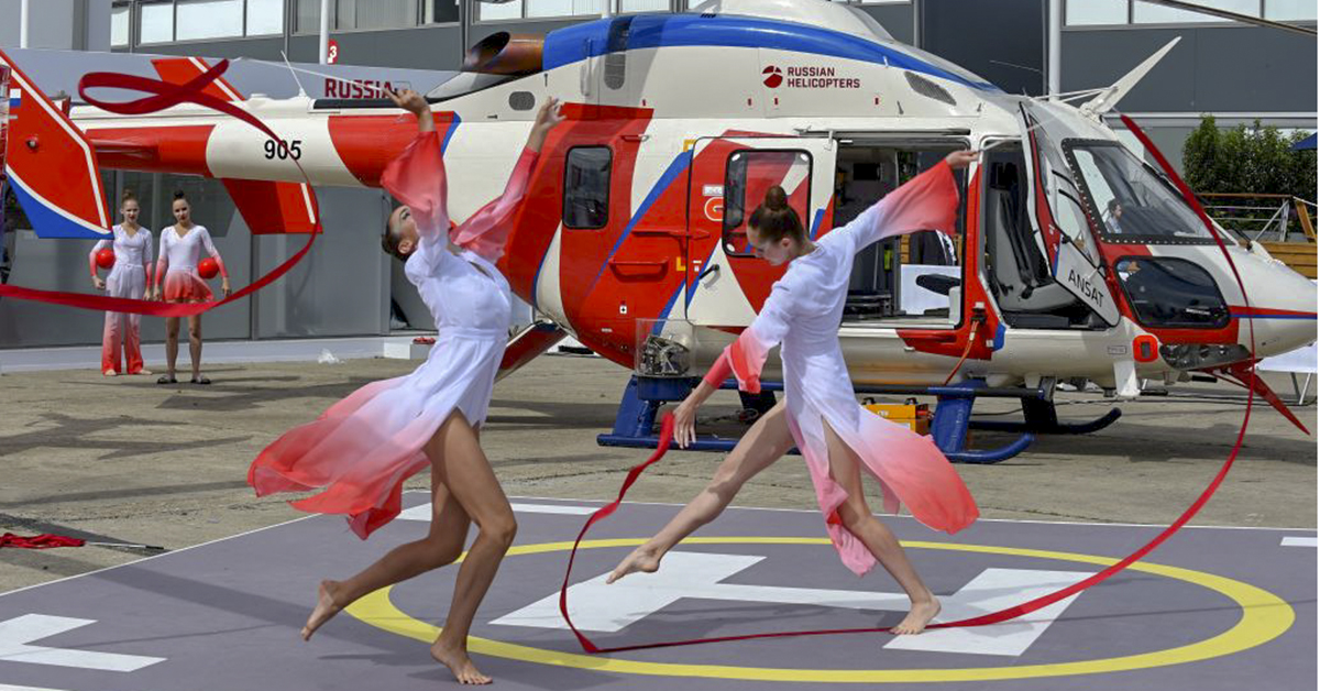 Gymnasts perform at the Russian Helicopters static display of the Ansat helo during the Paris Air Show on June 19, 2019. (Eric Piermont/AFP via Getty Images)