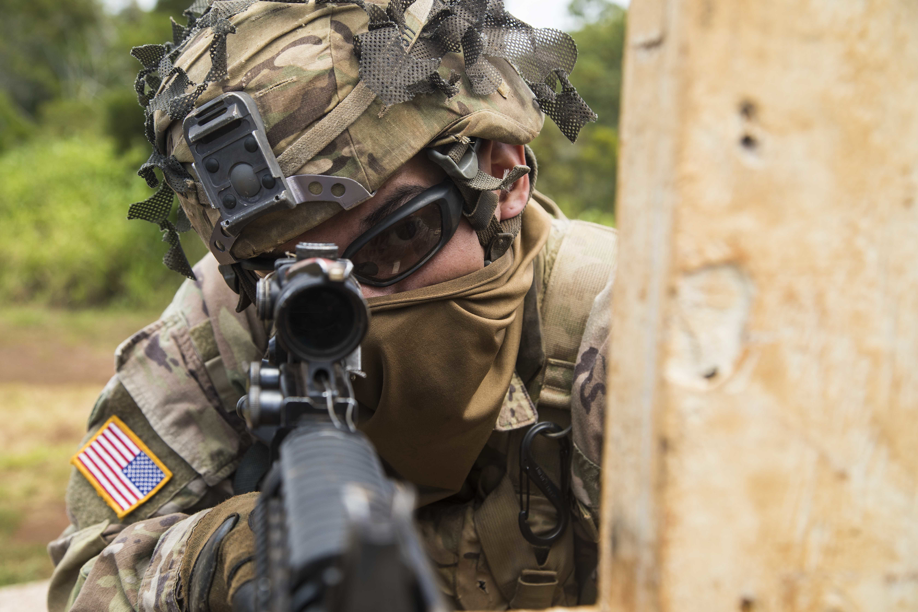 Spc. Raphael Ramos, a wheeled vehicle mechanic with G Company, 1st Battalion, 27th Infantry Regiment “Wolfhounds”, 2nd Infantry Brigade Combat Team, 25th Infantry Division scans his lane during a rifle qualification range May 1, 2020 at Schofield Barracks, Hawaii. Soldiers ensured they kept with social distancing guidelines as they demonstrated proficiency on their assigned weapons and trained on their lethal soldier skills. (Sgt. Thomas Calvert/Army)