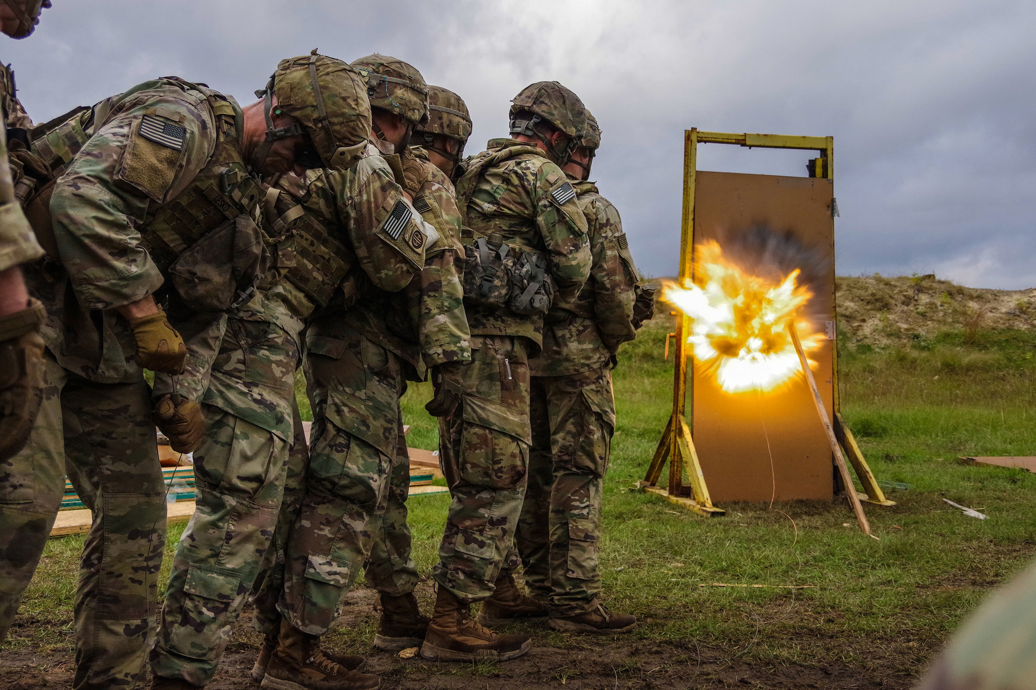 Paratroopers from Company A, 307th Airborne Engineer Battalion, 3rd Brigade Combat Team, 82nd Airborne Division observe as a door-breaching charge they emplaced detonates Nov. 6, 2018, on Fort Bragg, N.C. (Army)