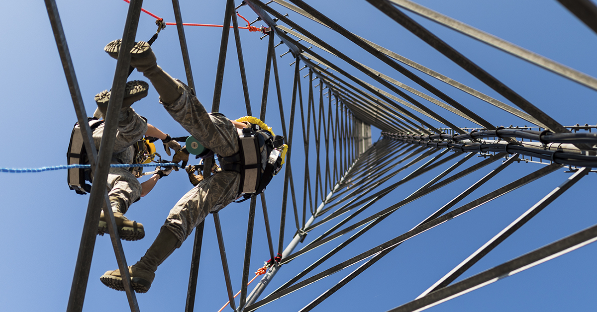 Airman 1st Class Cassandra Herlache, 9th Operation Support Squadron radar, airfield and weather apprentice, executes a climb during a trial run at Beale Air Force Base, Calif., Aug. 16, 2018. Airmen in the process of climbing must have three points of physical contact with the tower at all times. (Senior Airman Justin Parsons/Air Force)