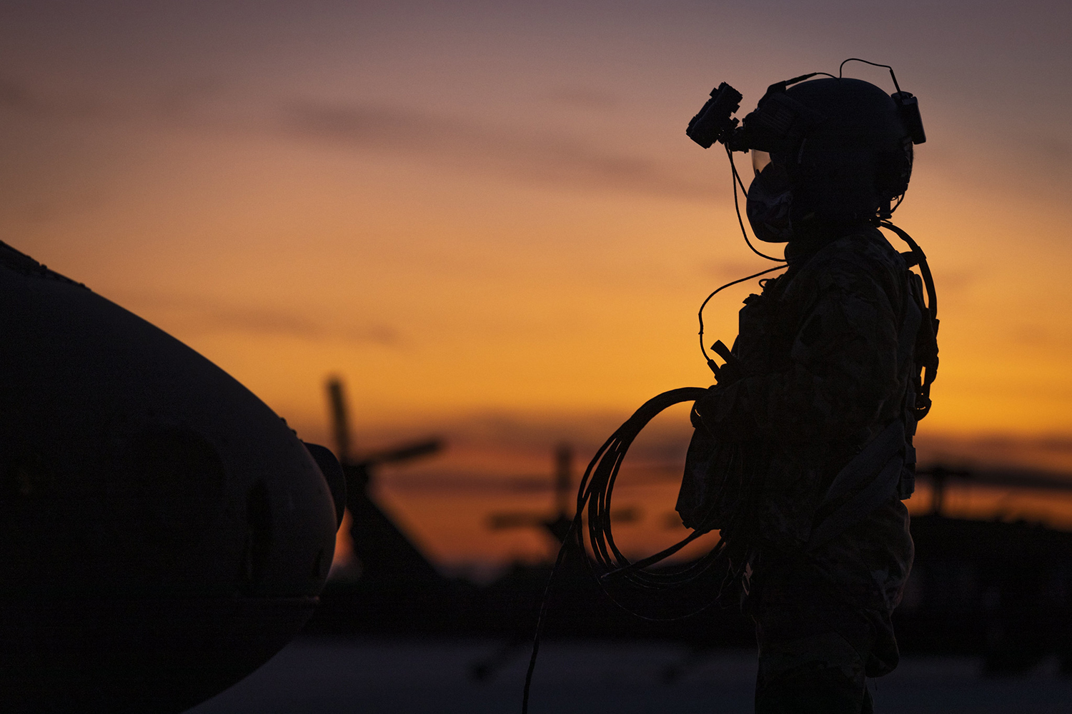 U.S. Army Sgt. Joseph Koszyk, a UH-60M Black Hawk helicopter crew chief with the New Jersey National Guard, prepares his aircraft for a night training mission at Joint Base McGuire-Dix-Lakehurst, N.J., Sept. 18, 2019. (Master Sgt. Matt Hecht/Air National Guard)