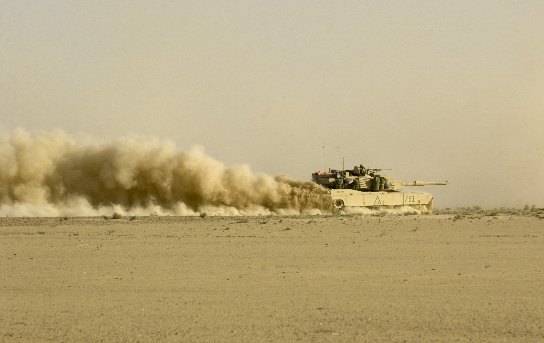 Troops from the U.S. Army's 3rd Squadron, 7th Cavalry Regiment on the move during invasion of Iraq on April 2, 2003. (Warren Zinn/Army Times)