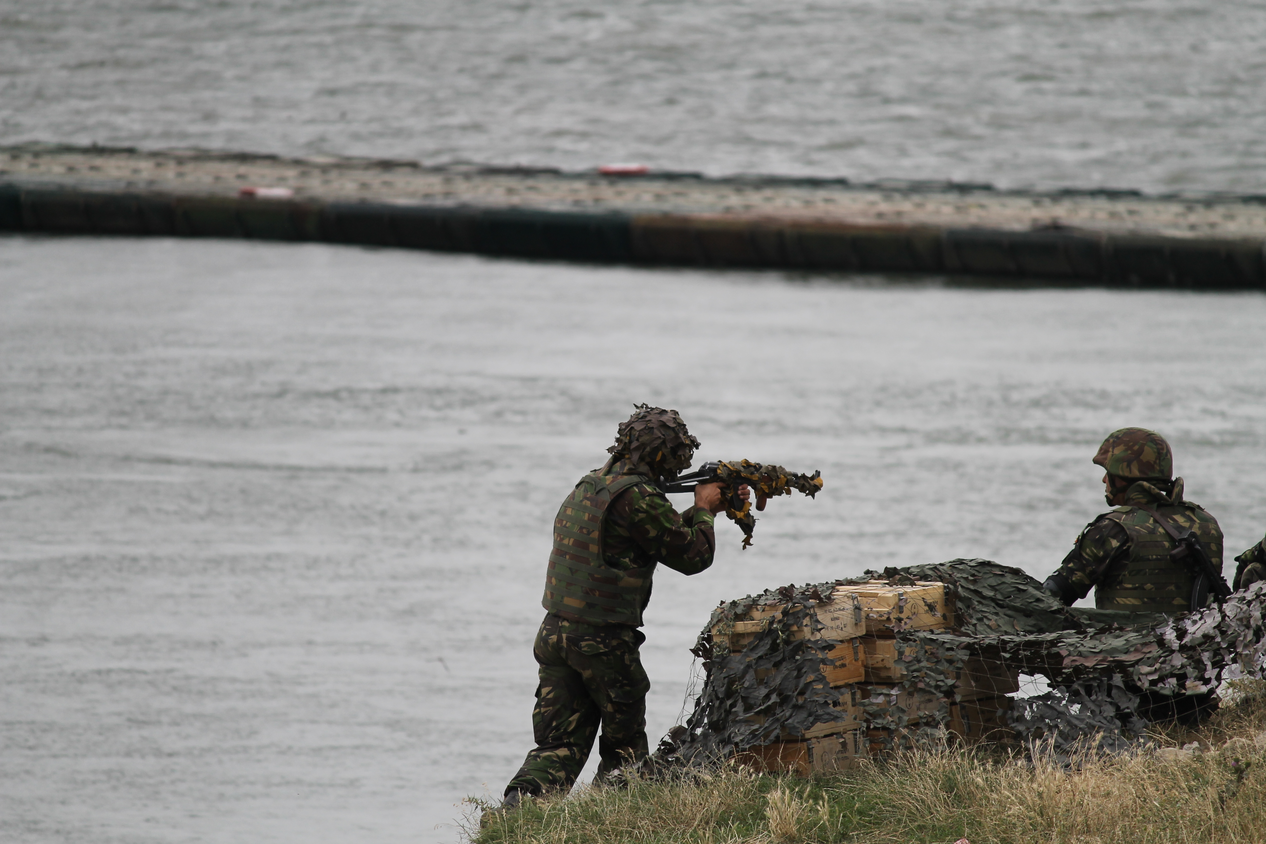 Troops from Romania defend the banks of the Danube and the bridge erected overnight as the exercise heats up. (Jen Judson/Staff)