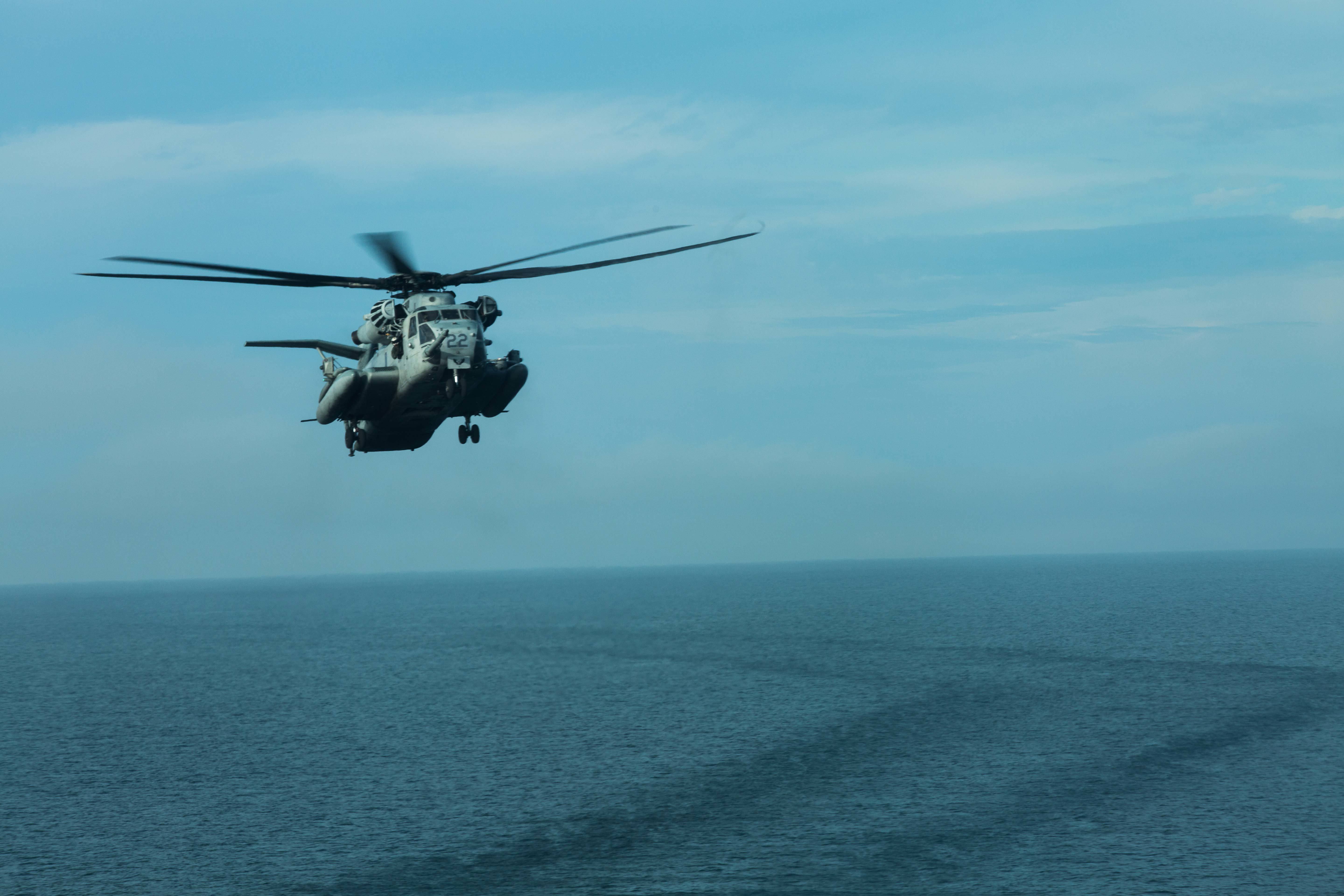 A U.S. Marine Corps CH-53E Super Stallion with Marine Medium Tiltrotor Squadron (VMM) 162 (REIN), 26th Marine Expeditionary Unit (MEU), approaches the flight deck of the amphibious landing dock ship USS New York (LPD 21) during Combined Composite Unit Training Exercise. (Cpl. Jered T. Stone/Marine Corps)