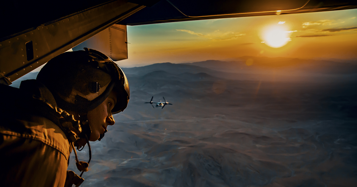 Sgt. Derek Levi, MV22 crew chief, Marine Medium Tilt Rotor Squadron, Marine Aircraft Group 16, 3rd Marine Aircraft Wing looks over the landscape of Marine Corps Air Ground Combat Center, Twentynine Palms, Calif., during an aerial flight formation exercise August 12, 2018. “I get to see the world from the sky,” said Sgt. Derek Levi, MV22 crew chief, Marine Medium Tilt Rotor Squadron, Marine Aircraft Group 16, 3rd Marine Aircraft Wing. (Lance Cpl. Rachel K. Young/Marine Corps)