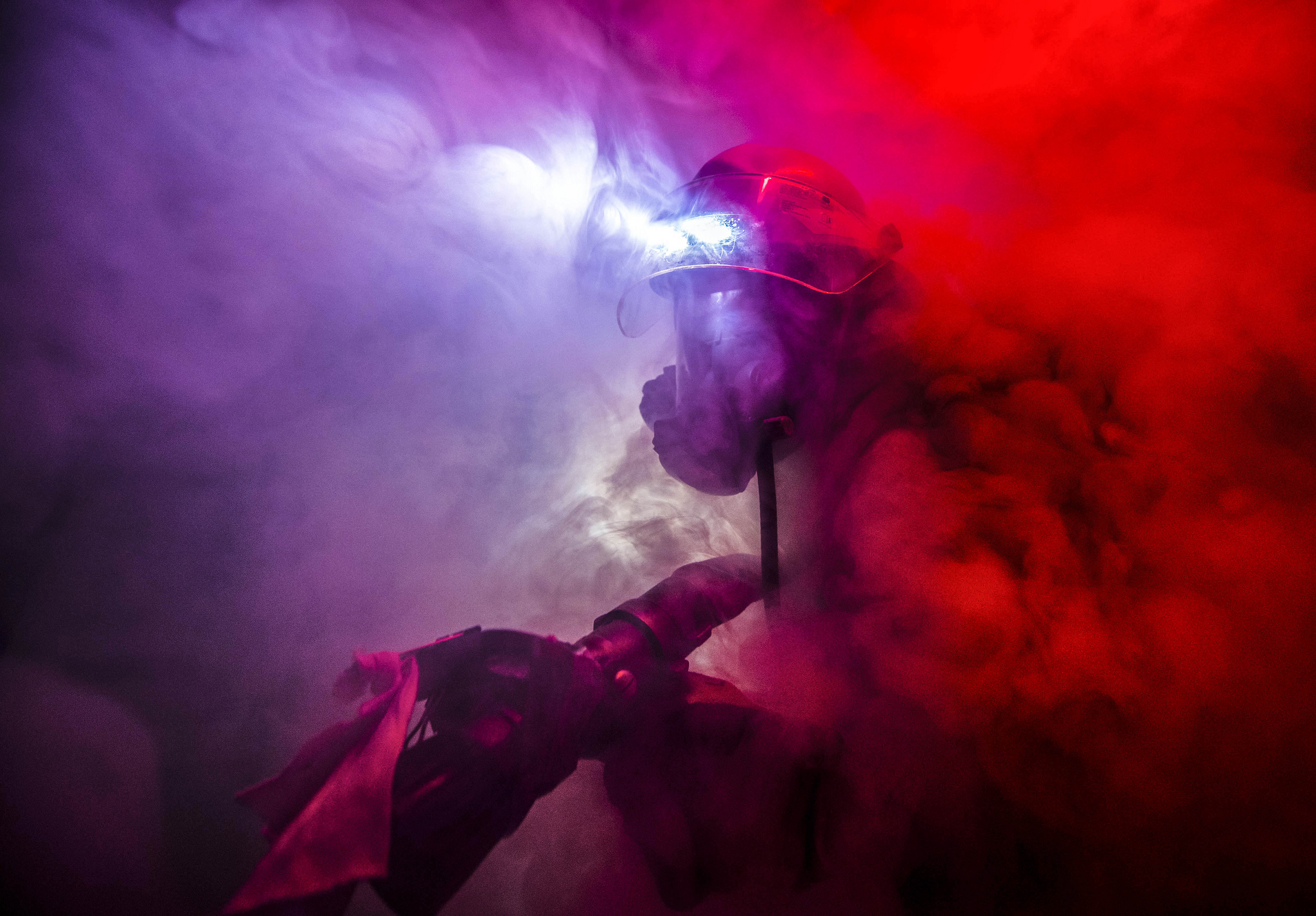 Damage Controlman Fireman James Moore fights a simulated fire during a drill aboard the Arleigh Burke-class guided-missile destroyer USS Porter (DDG 78) in the North Sea, Feb. 4, 2019. (Mass Communication Specialist 2nd Class James R. Turner/Navy)