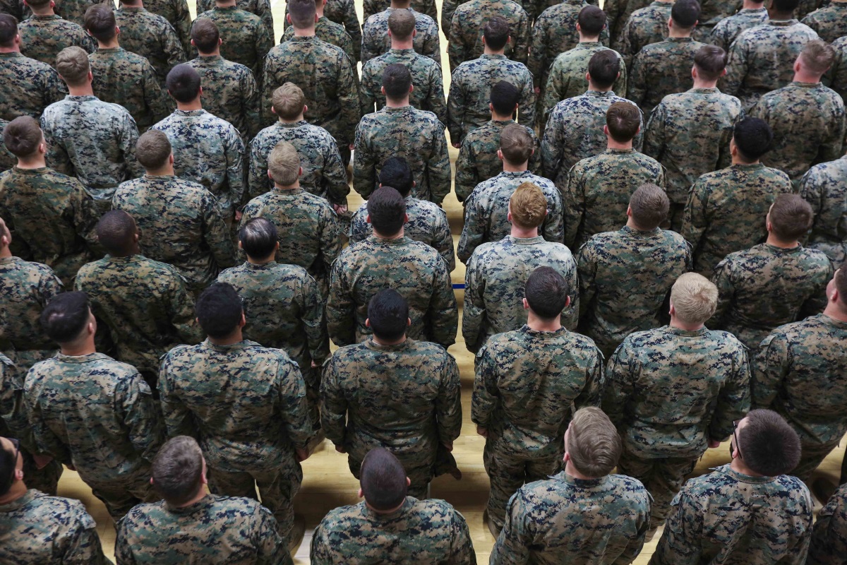 Marines and sailors with Special Purpose Marine Air-Ground Task Force stand at attention before Commandant of the Marine Corps Gen. Robert B. Neller speaks in Sigonella, Italy, Dec. 25, 2018. (Sgt. Olivia G. Ortiz/Marine Corps)