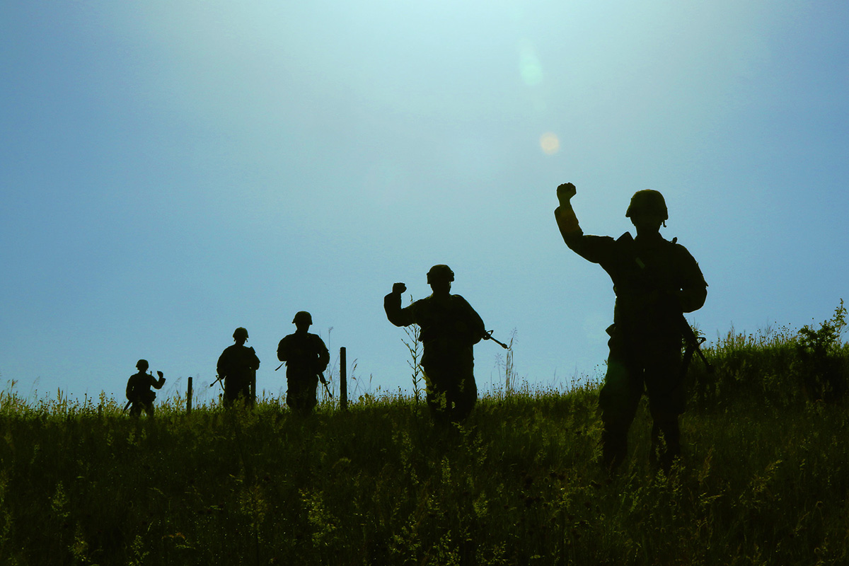 Members of the 838th Military Police Company out of Youngstown, Ohio, conduct a cordon and search exercise in the lush green Preševo Valley June 13 as part of Platinum Wolf 2019 in South Base, Serbia. (Staff Sgt. Chad Menegay/National Guard)