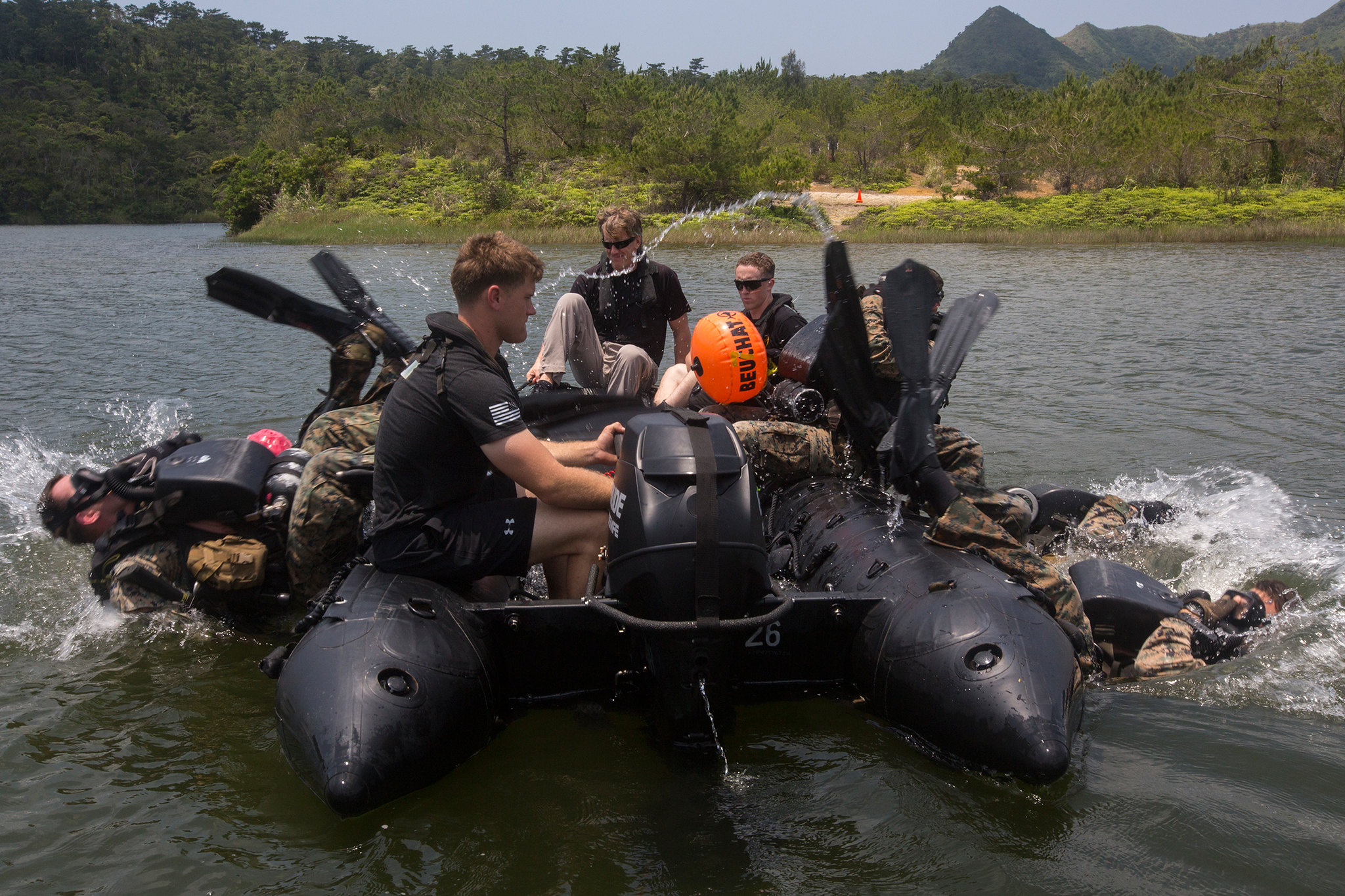 Reconnaissance Marines roll backward into the water during training at Camp Hansen, Okinawa, Japan, May 13, 2019. (Lance Cpl. Cameron E. Parks/Marine Corps)