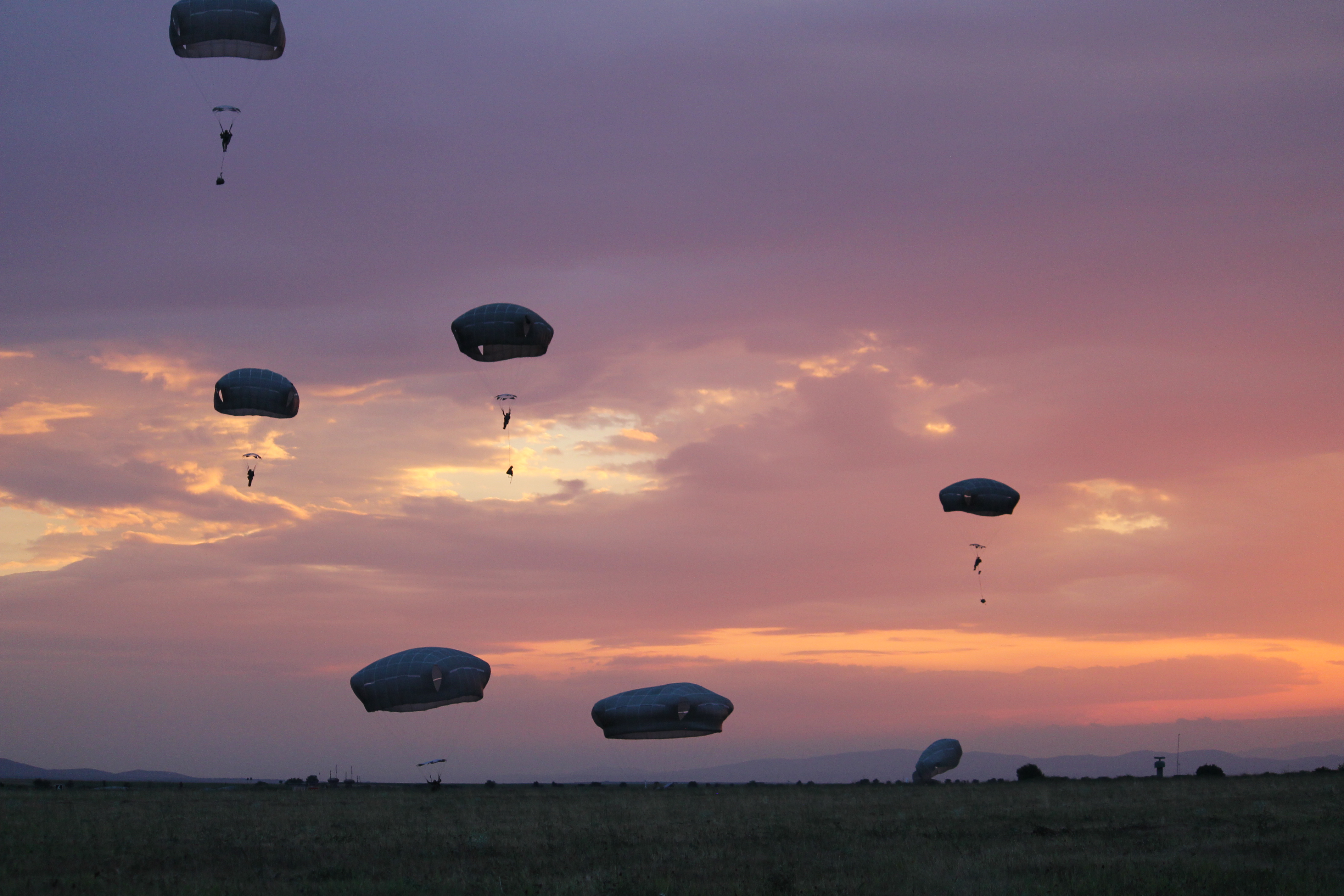 Paratroopers at Swift Response viewed a stunning sunset at Bezmer Air Base, Bulgaria, as the backdrop for their jump. (Jen Judson/Staff)