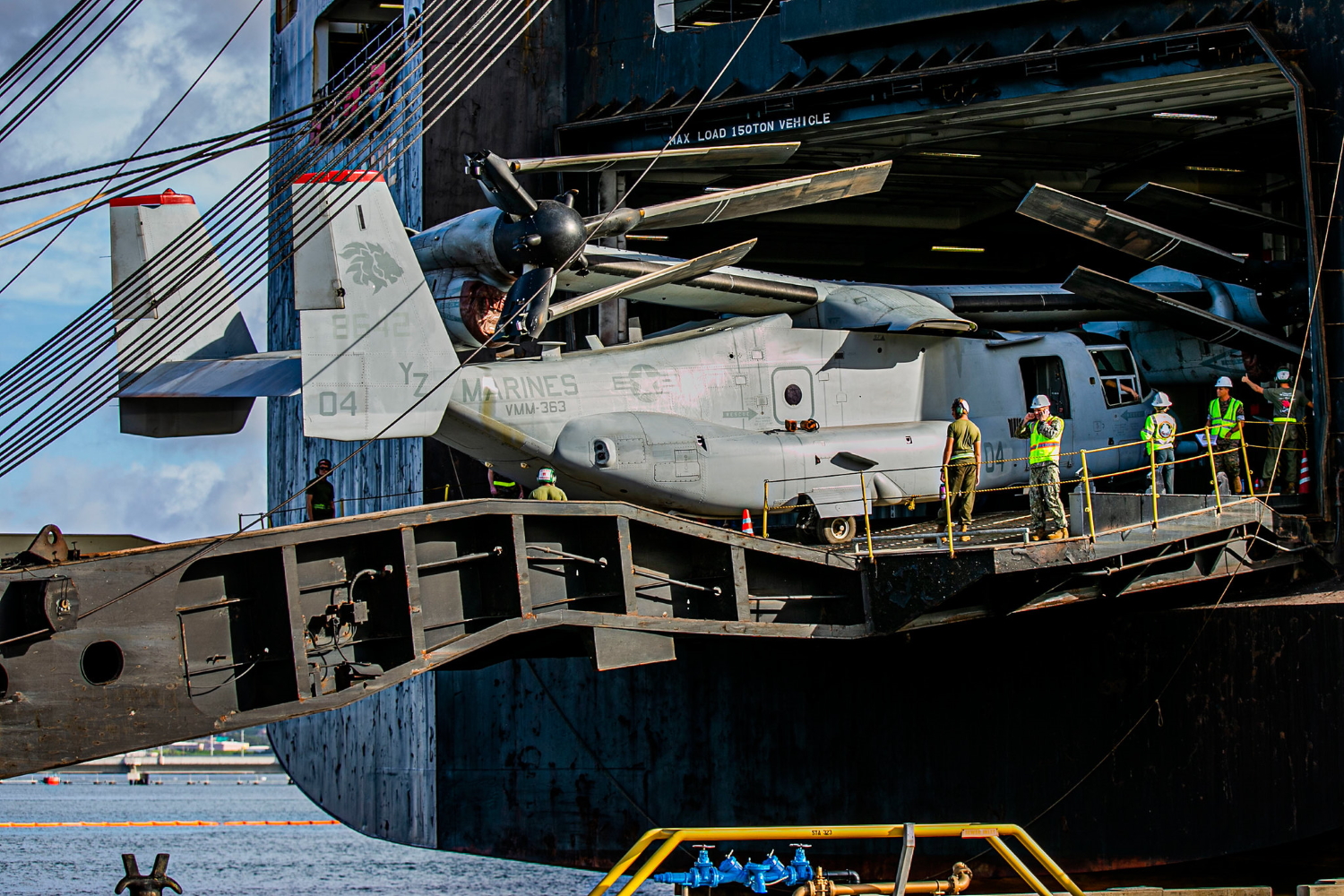 Marines offload an MV-22 Osprey from a vehicle carrier vessel on Joint Base Pearl Habor-Hickam, Hawaii, on Oct. 4, 2019, following a six-month deployment as part of Marine Rotational Force-Darwin. (Lance Cpl. Jacob Wilson/Marine Corps)