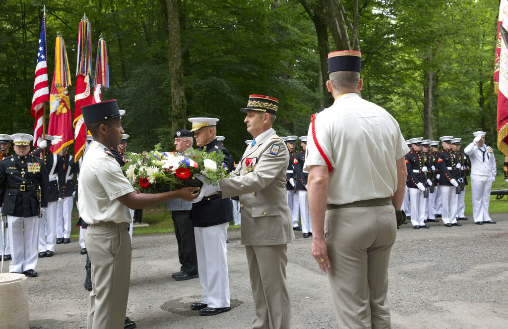 Military representatives from the United States, France and Germany place wreaths at the American Marine Memorial in Belleau Wood prior to a Memorial Day commemoration at the Aisne-Marne American Cemetery in Belleau, France, Sunday, May 27, 2018. (Virginia Mayo/AP)