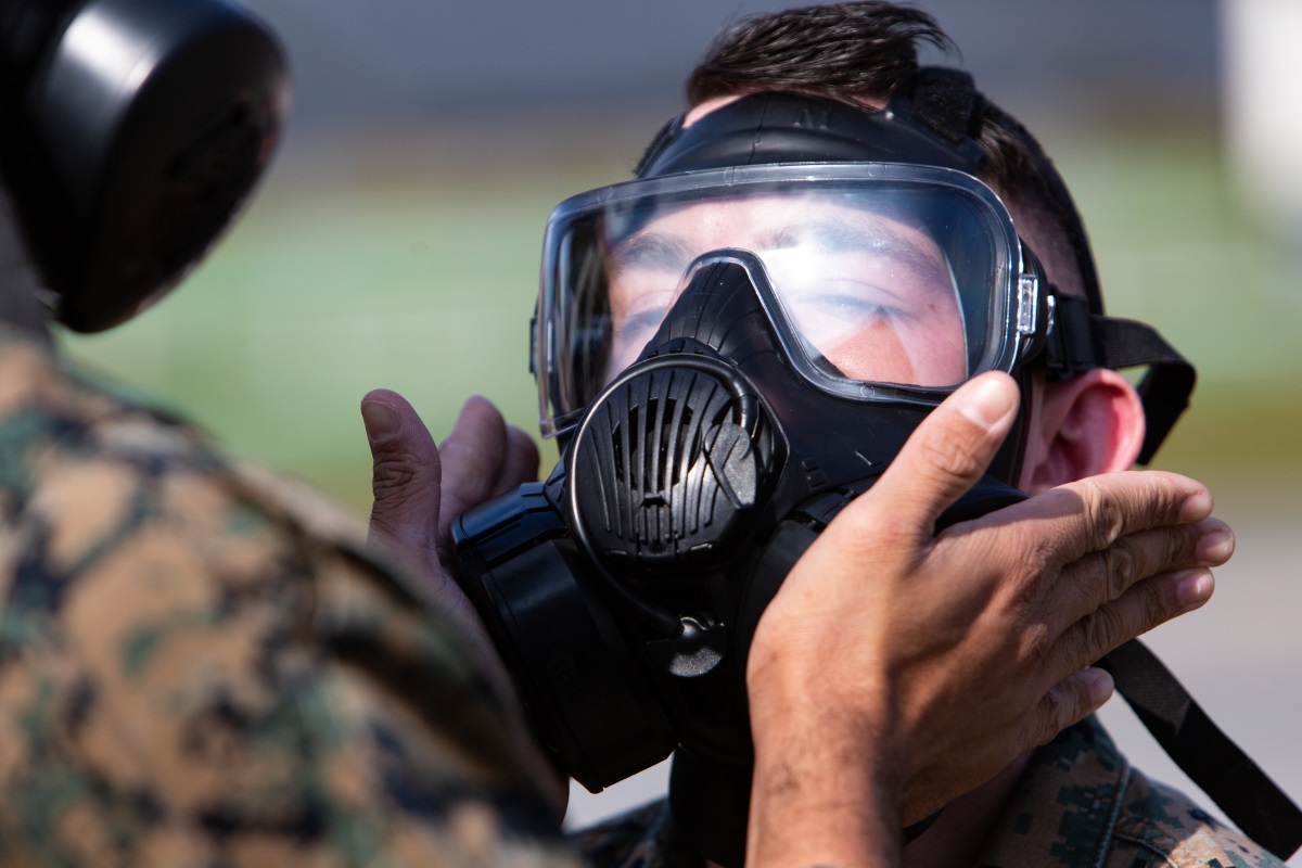 A Marine tests the fit of his M50 Joint Service General Purpose Mask outside the gas chamber at Camp Hansen, Okinawa, Japan, Dec. 19, 2018. (Lance Cpl. Andrew R. Bray/Marine Corps)
