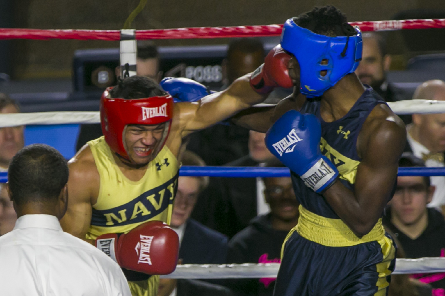 Jordon McDaniel (in gold) from East Chicago, IN, throws a punch into Kendell Louis (in blue) from Miami, FL in the 147-lb weight class bout during the United States Naval Academy's 77th Brigade Boxing Championships held on Feb. 23, 2018. Louis won the fight. (Alan Lessig/Staff)