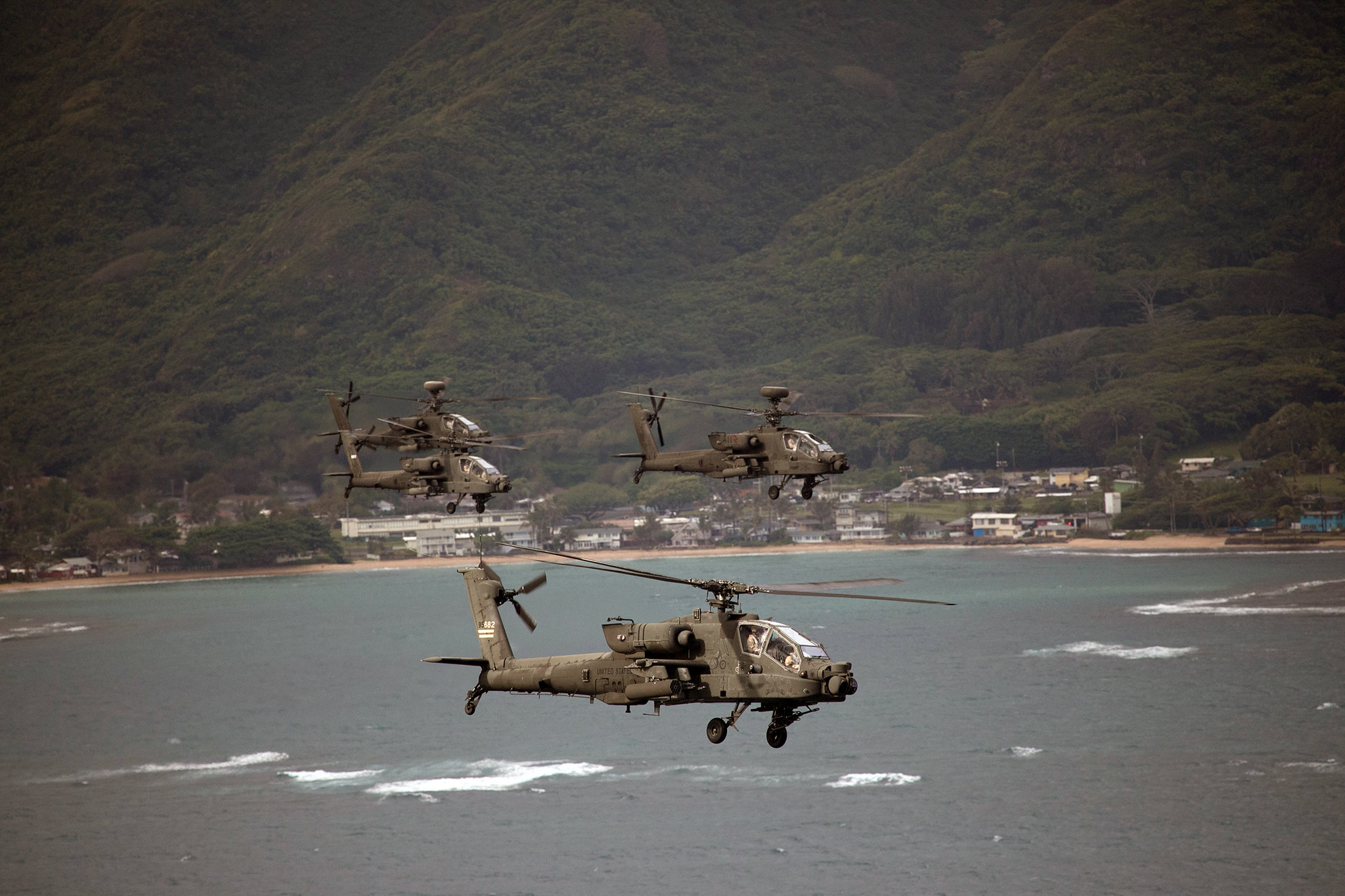 The 25th Combat Aviation Brigade, 25th Infantry Division flies 19 AH-64 Apache helicopters in an organized formation around Oahu on May 1, 2019. (Sgt. Ryan Jenkins/Army)