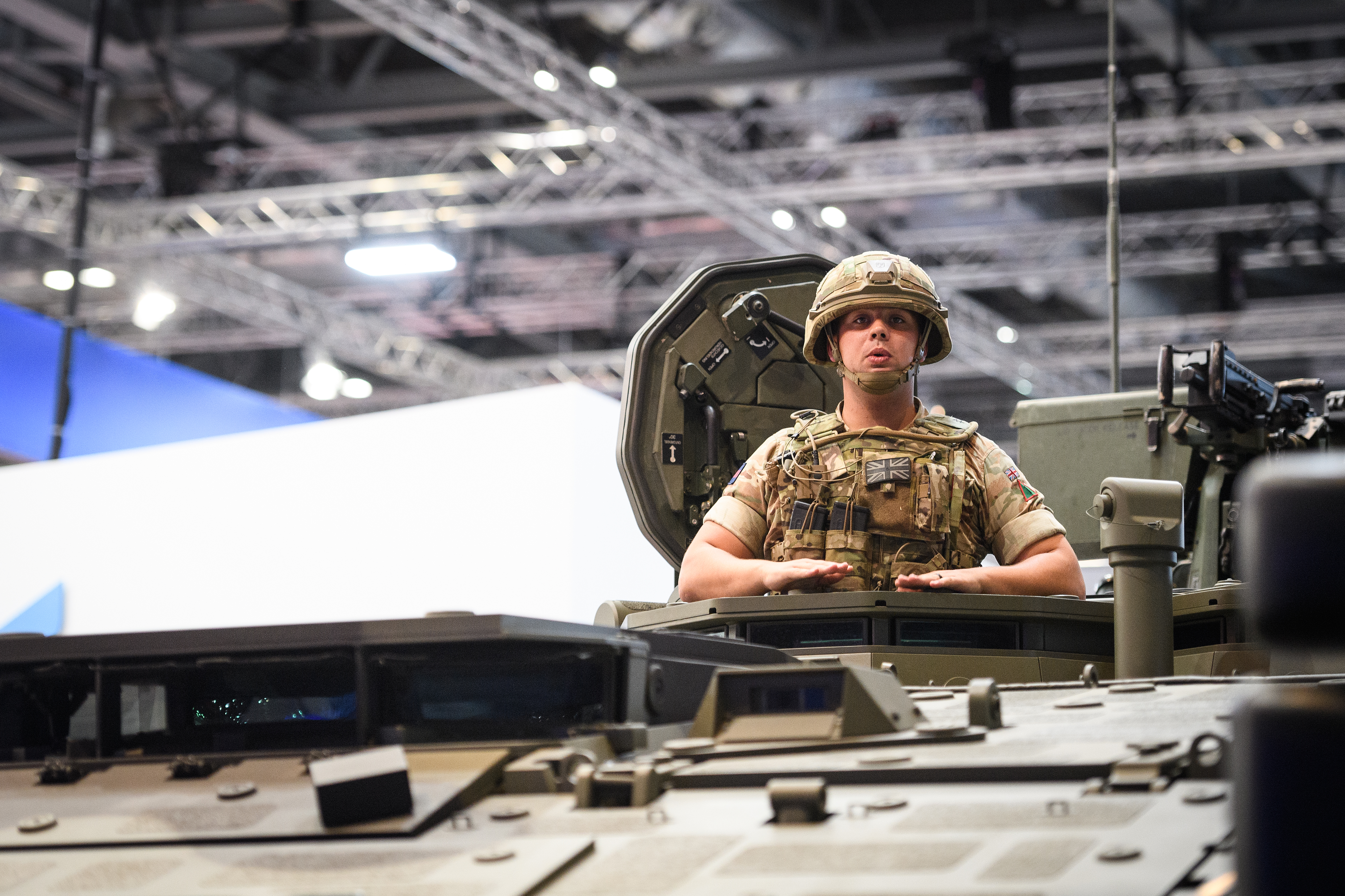 A soldier sits in a Boxer armored vehicle at the DSEI arms fair in London on Sept. 11, 2019. Held every two years, the event is the world's largest arms fair. (Leon Neal/Getty Images)