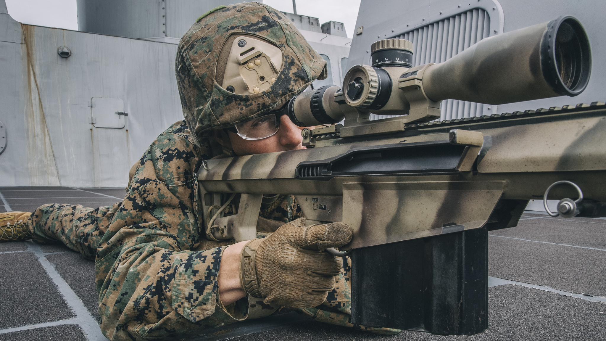 1st Lt. Nathaniel Lambert sights in behind a .50-caliber Special Applications Scoped Rifle on Feb. 20, 2019, during a simulated strait transit aboard the San Antonio-class amphibious transport dock ship USS John P. Murtha (LPD 26) in the Pacific Ocean. (Lance Cpl. Israel Chincio/Marine Corps)