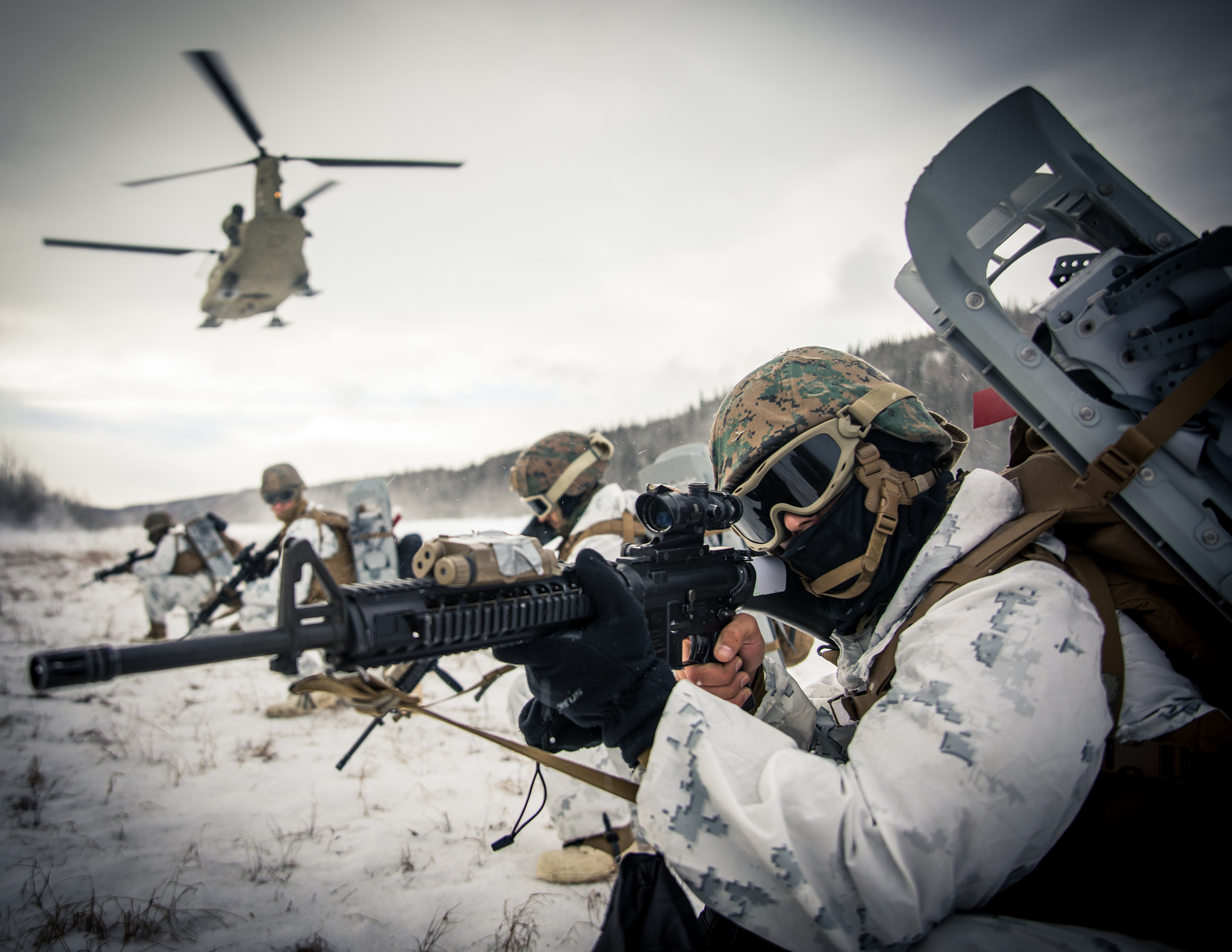Lance Cpl. Andrew Z. Munoz, right, a motor vehicle operator with 7th Engineer Support Battalion, 1st Marine Logistic Group, provides security at Fort Greely, Alaska, Feb. 19, 2020, in preparation for exercise Arctic Edge 2020. (Lance Cpl. Jose Gonzalez/Marine Corps)