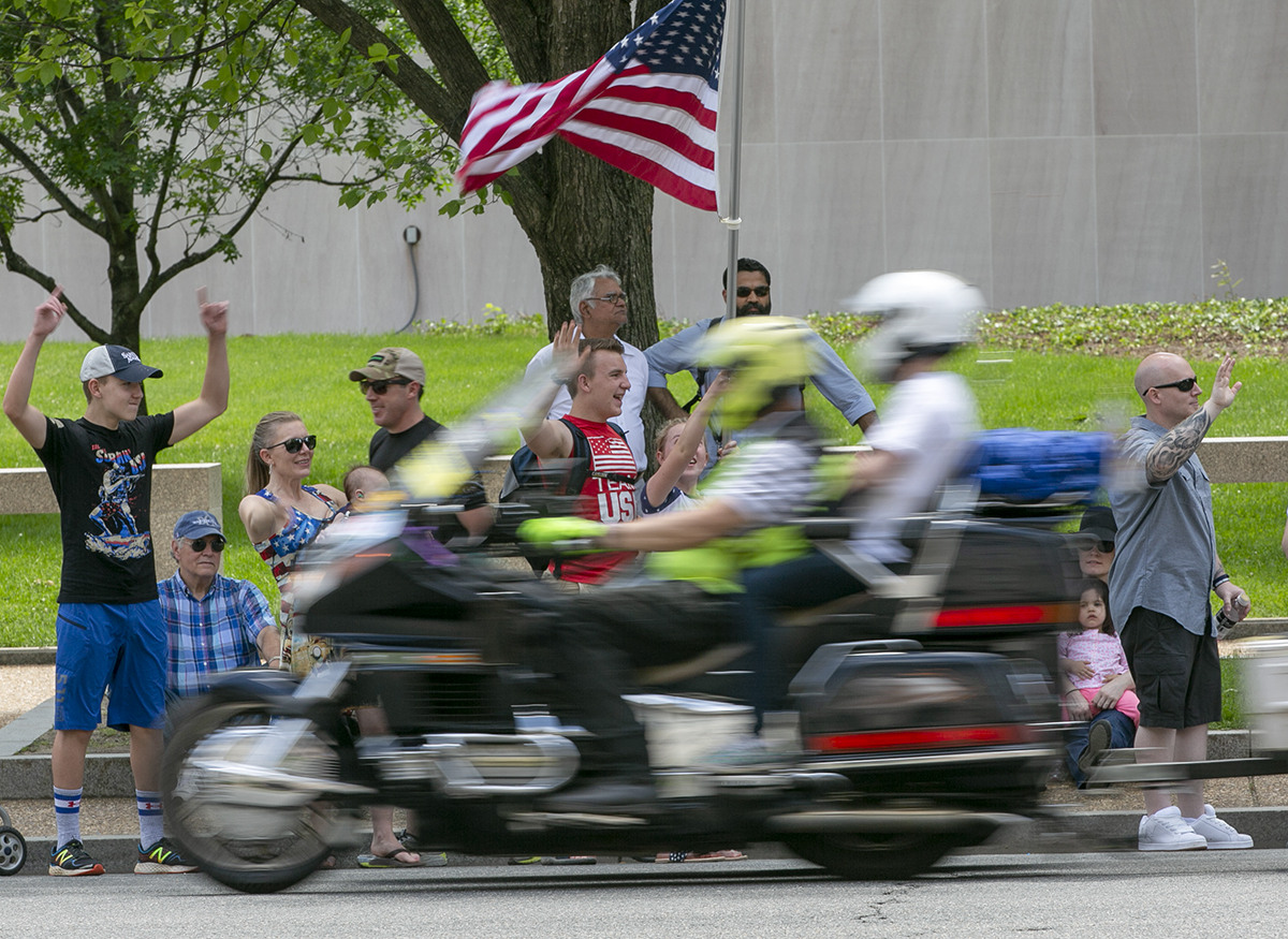 Spectators waved to riders during the Rolling Thunder XXXI First Amendment Demonstration Run along Constitution Ave. in Washington, DC on Sunday May 27, 2018. Motorcycle riders from across the nation, rode a designated route through the Mall area of Washington, D.C. The event is an actual demonstration/protest to bring awareness and accountability for POWs and MIAs left behind.(Alan Lessig/Staff)